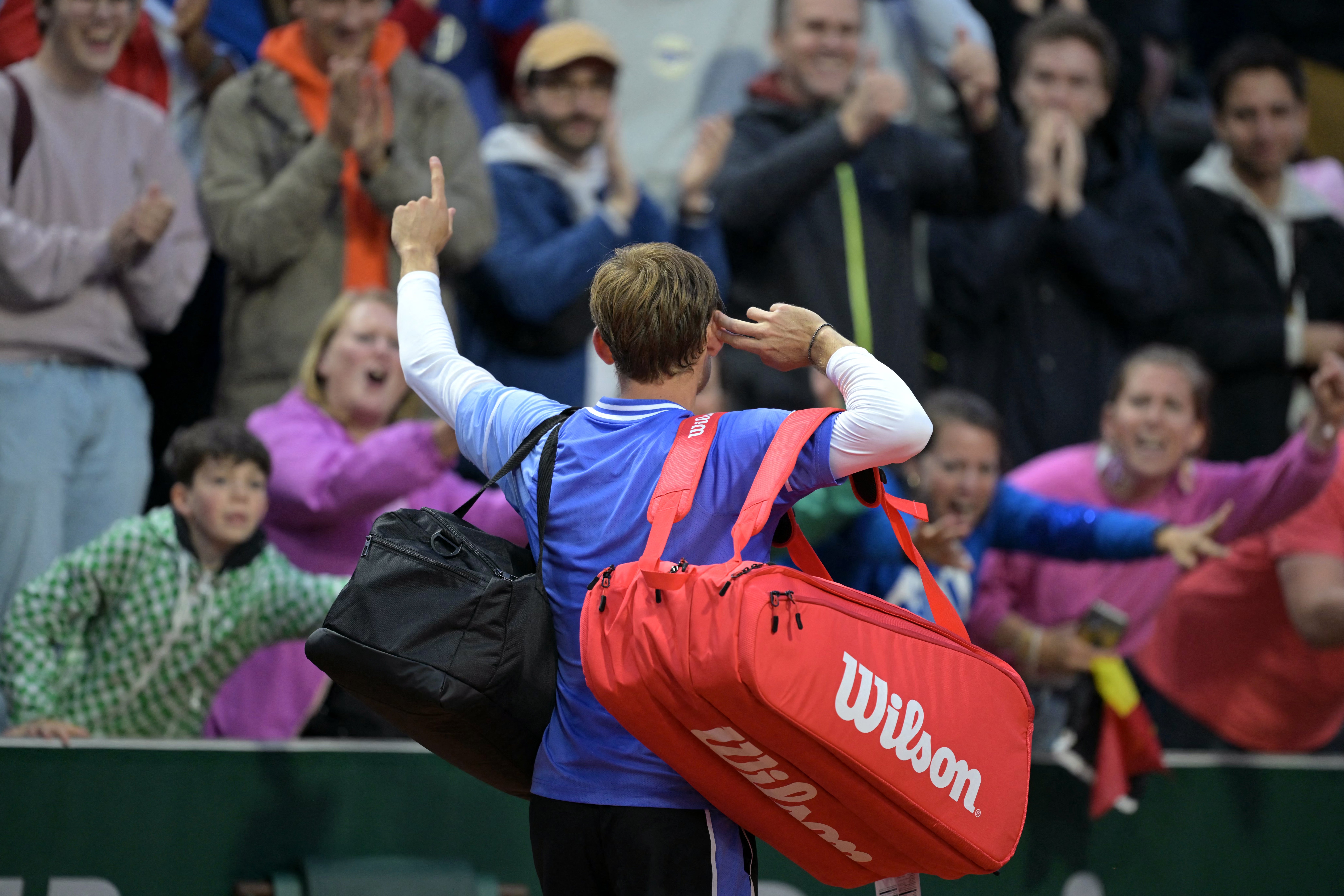 Belgium’s David Goffin reacts to the French Open spectators after victory