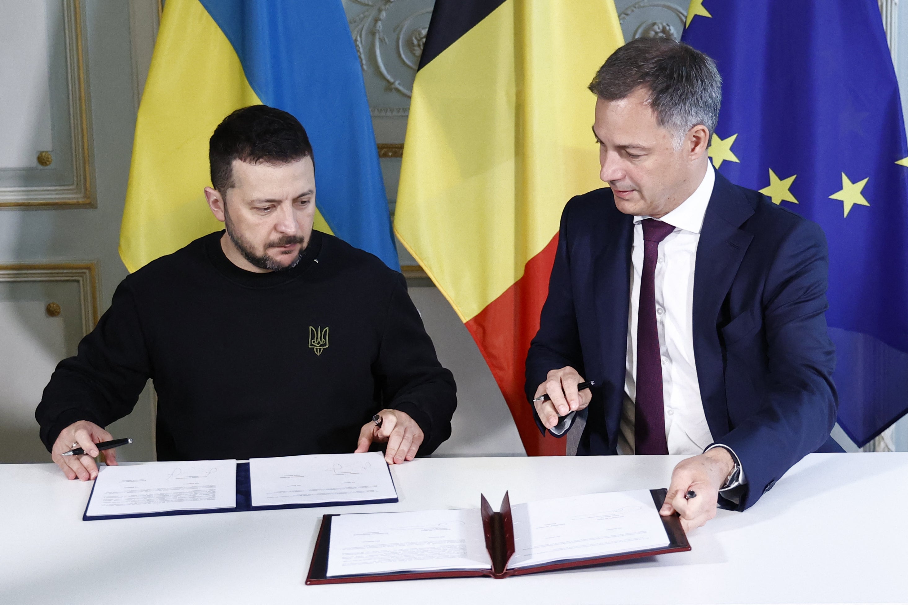 Ukraine's president Volodymyr Zelensky and Belgian prime minister Alexander De Croo sign a bilateral security accord in Brussels