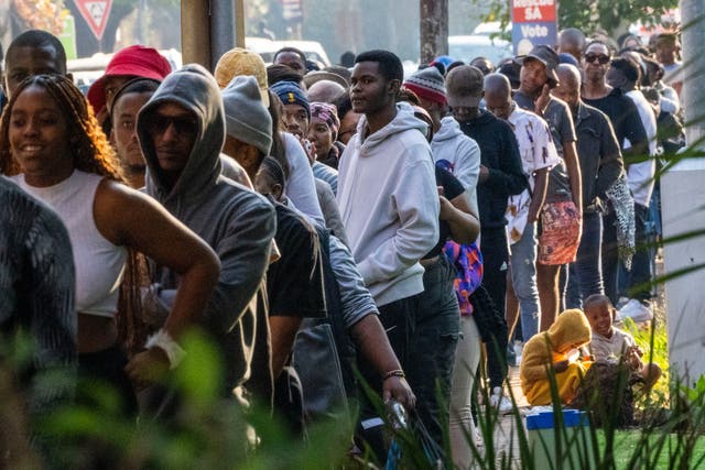 <p>Voters line up to cast their ballot near Wits University, Johannesburg</p>