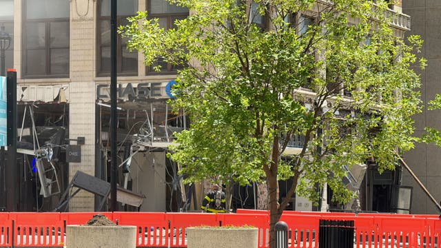 <p>Firefighters assess the damage after explosion in Youngstown </p>