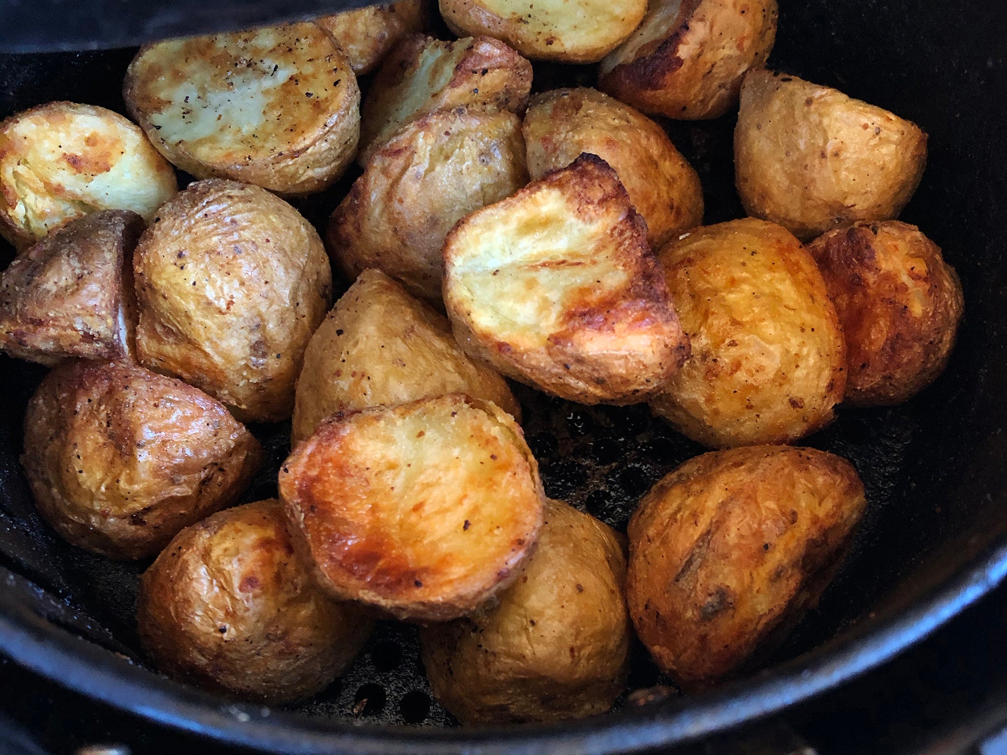 Crispy roasted potatoes seasoned with rosemary and garlic, fresh out of the air fryer