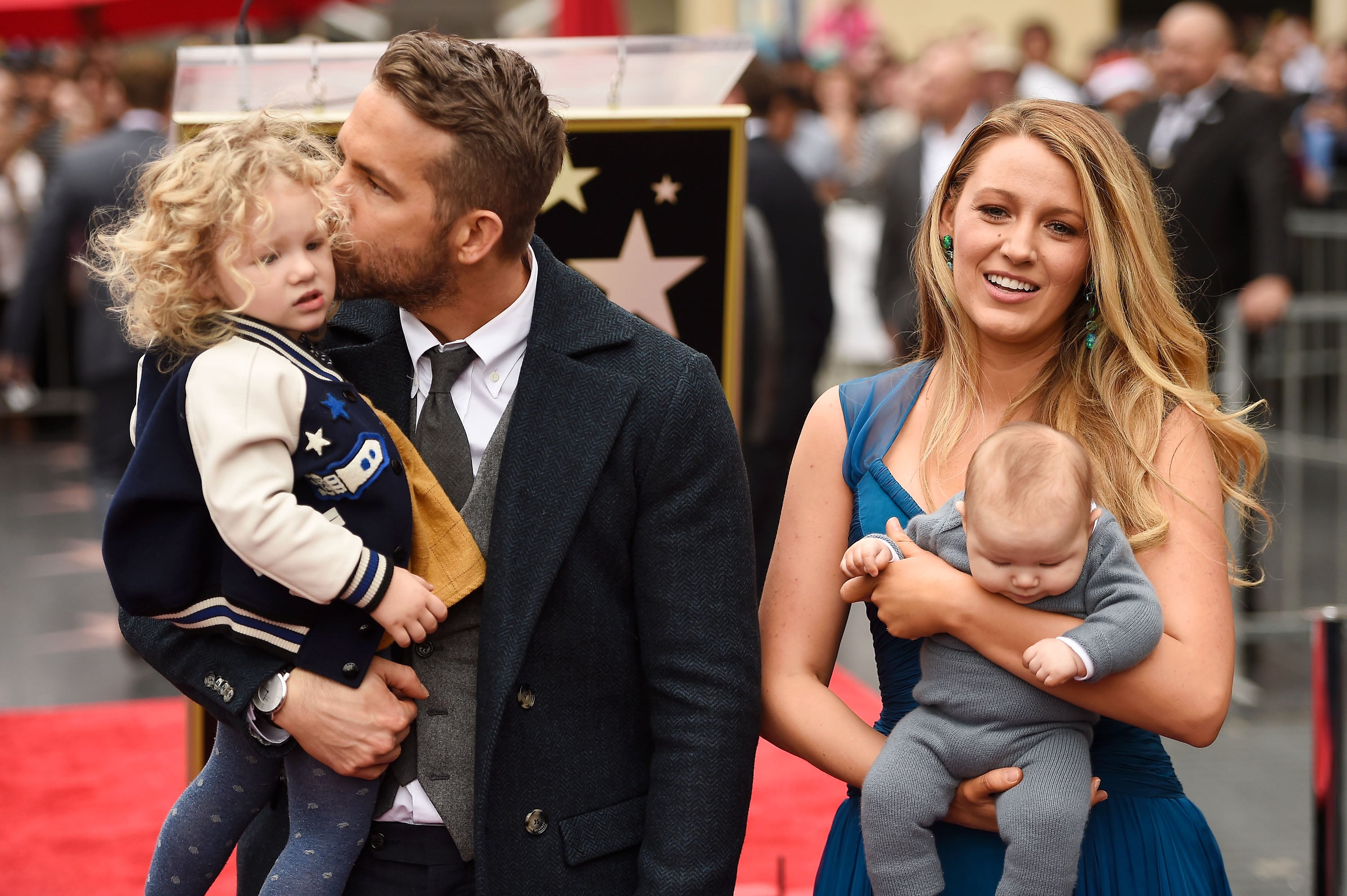 Ryan Reynolds and Blake Lively pose with their daughters during the Hollywood Walk of Fame ceremony in December 2016.