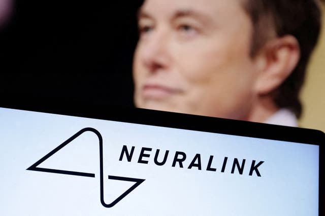 <p>Elon Musk and the Neuralink logo, pictured in 2022. A former Neuralink employee is suing the company, claiming she was fired after she told her superiors that she was pregnant </p>