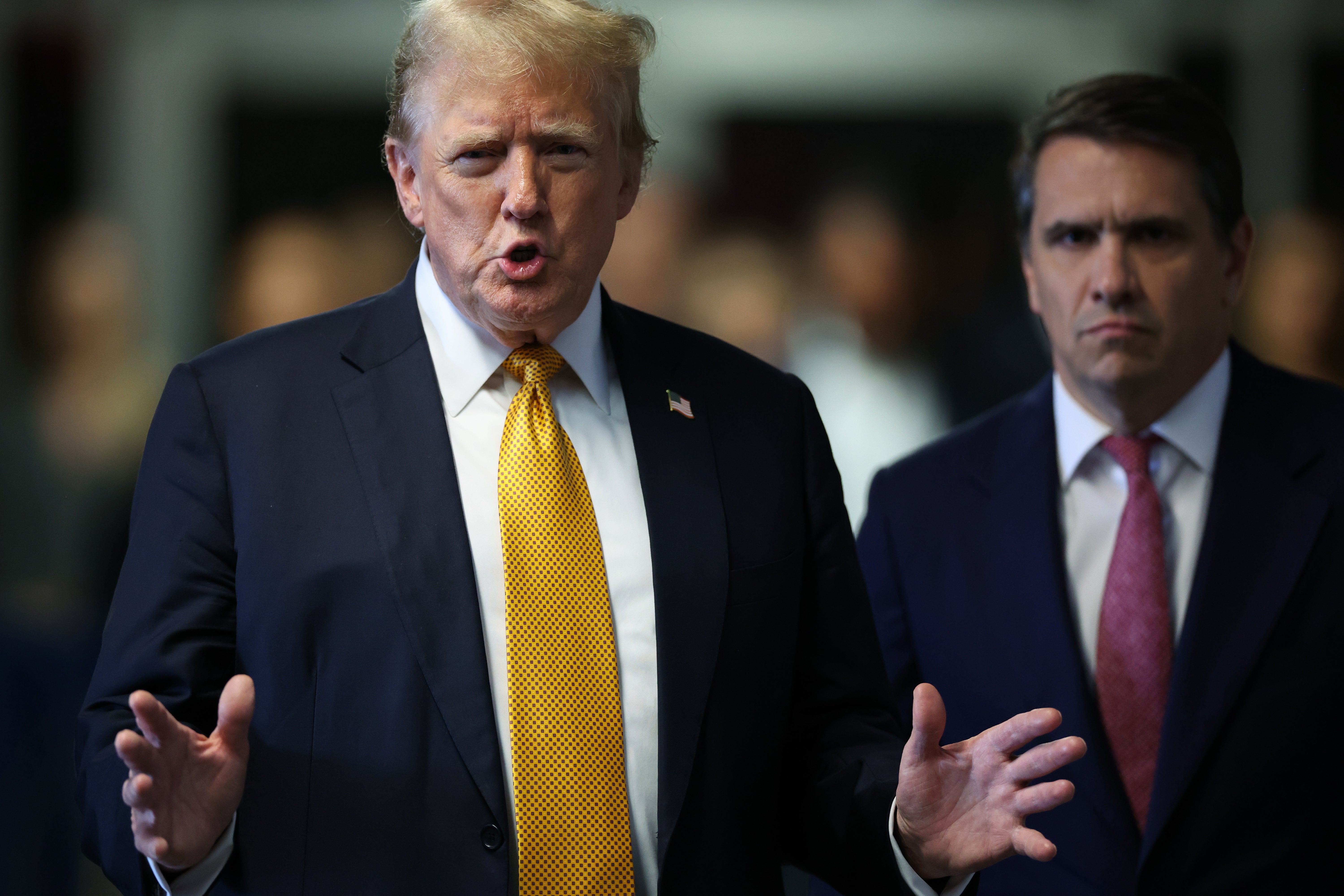 Donald Trump walks toward the press to speak after the 12 jurors in his criminal trial began deliberating at Manhattan Criminal Court on 29 May