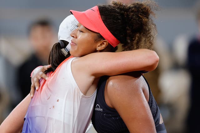 <p>Naomi Osaka, right, congratulates Iga Swiatek </p>