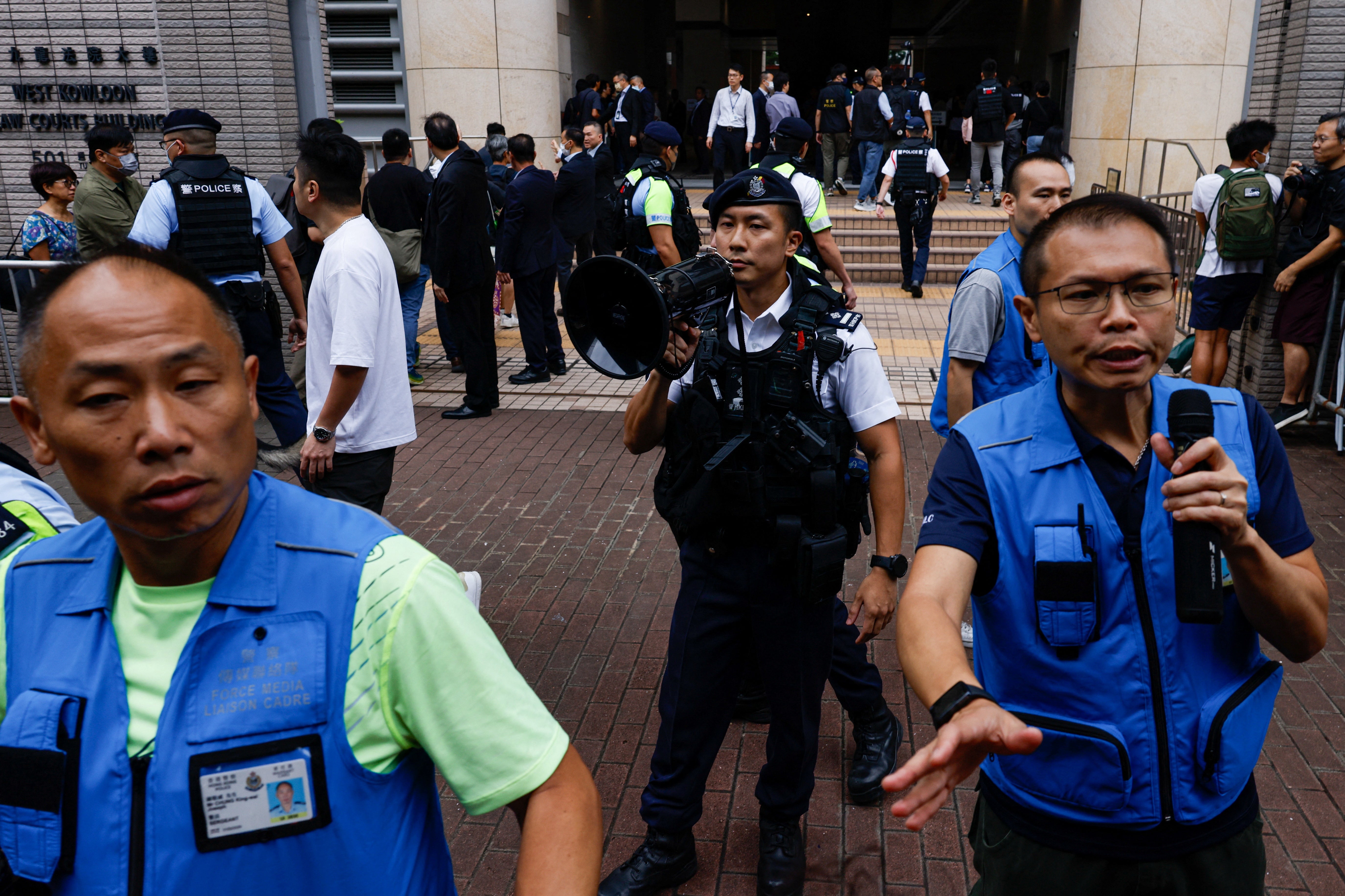 Police stand guard outside the West Kowloon Magistrates' Courts building, before the verdict of theÂ 47Â pro-democracyÂ activistsÂ charged under the national security law, in Hong Kong