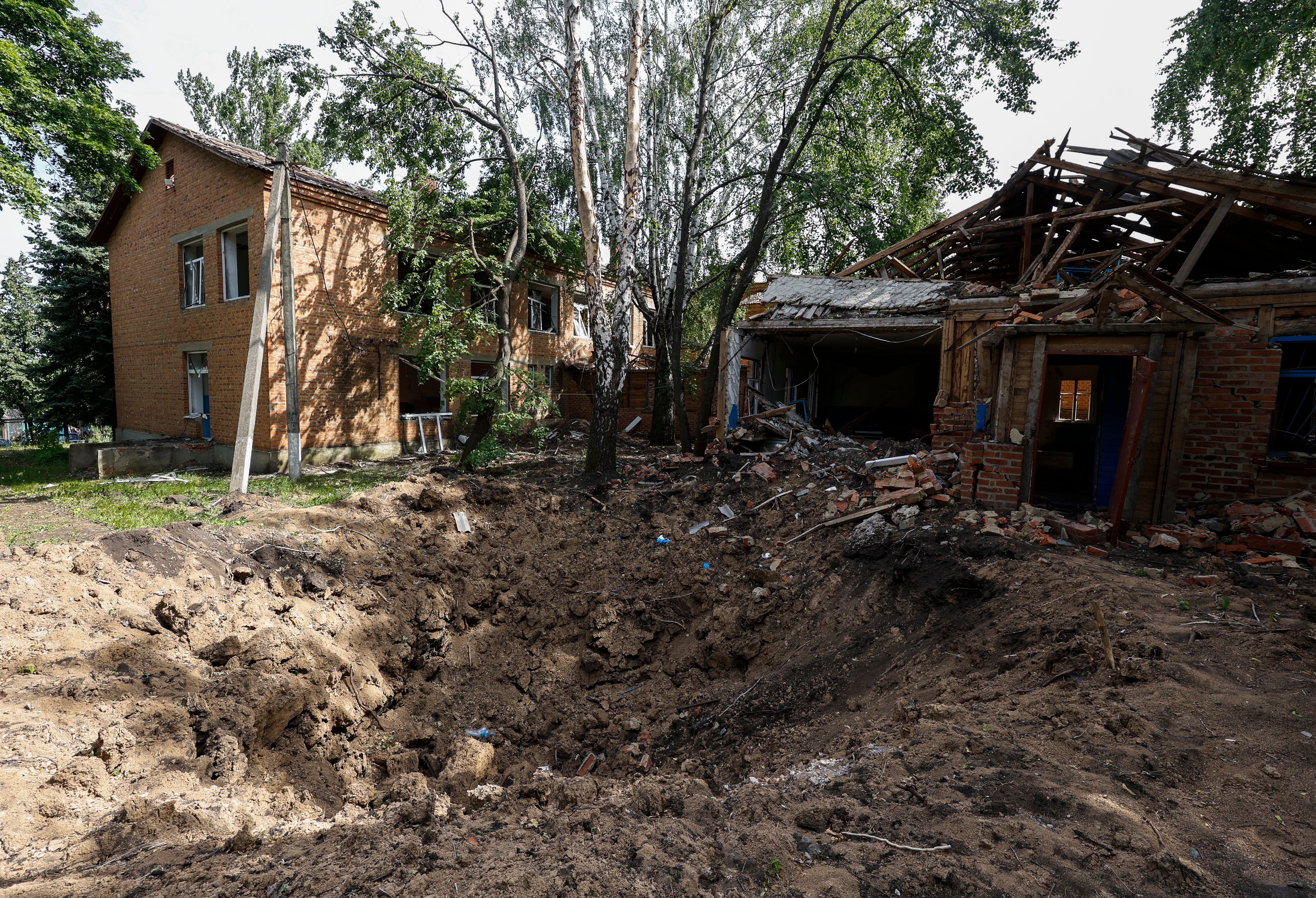 Destroyed buildings and a shooting hall in the village of Katerynivka are pictured in the Kharkiv region