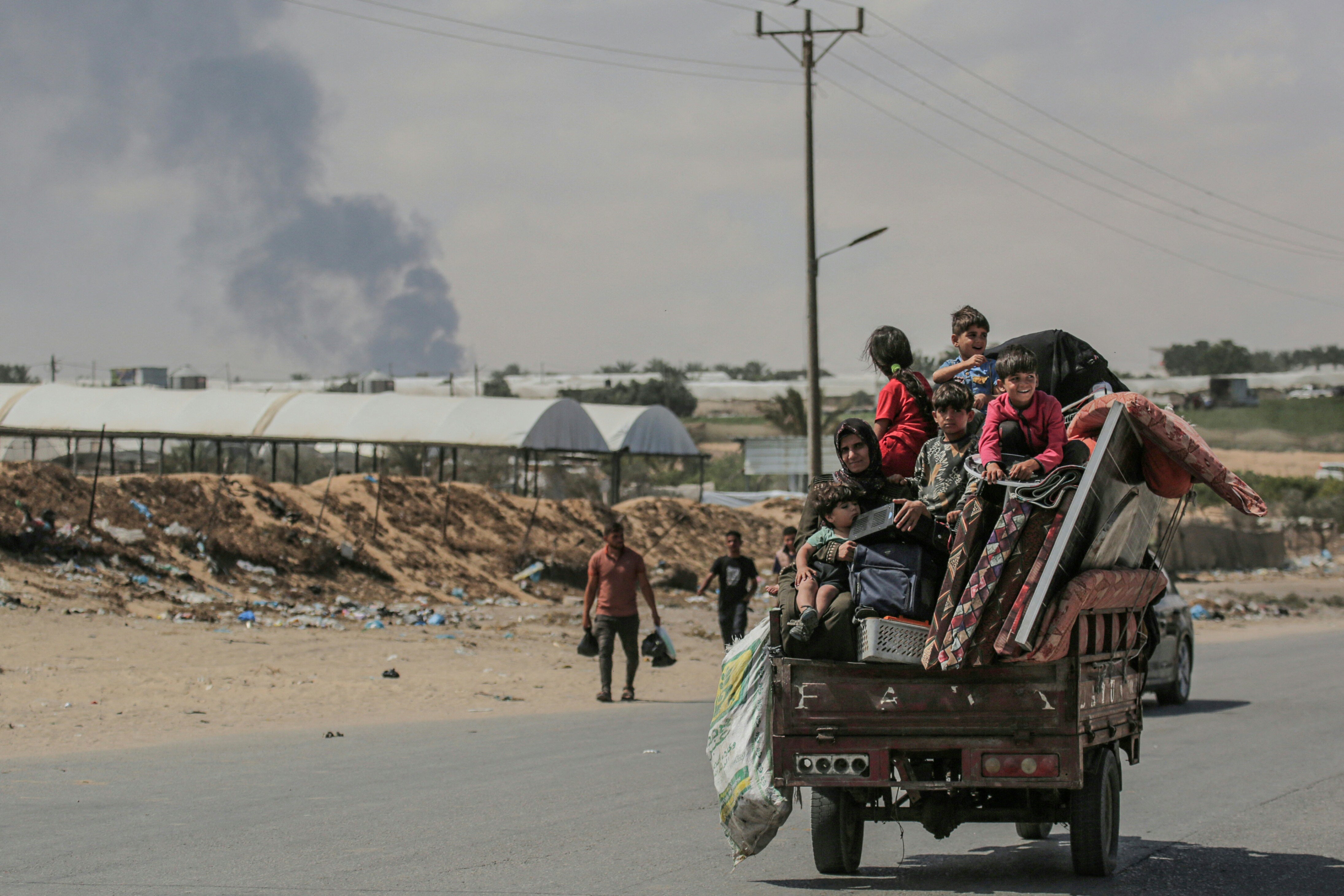 Palestinians flee Rafah with their belongings during an Israeli assault on the south Gazan city