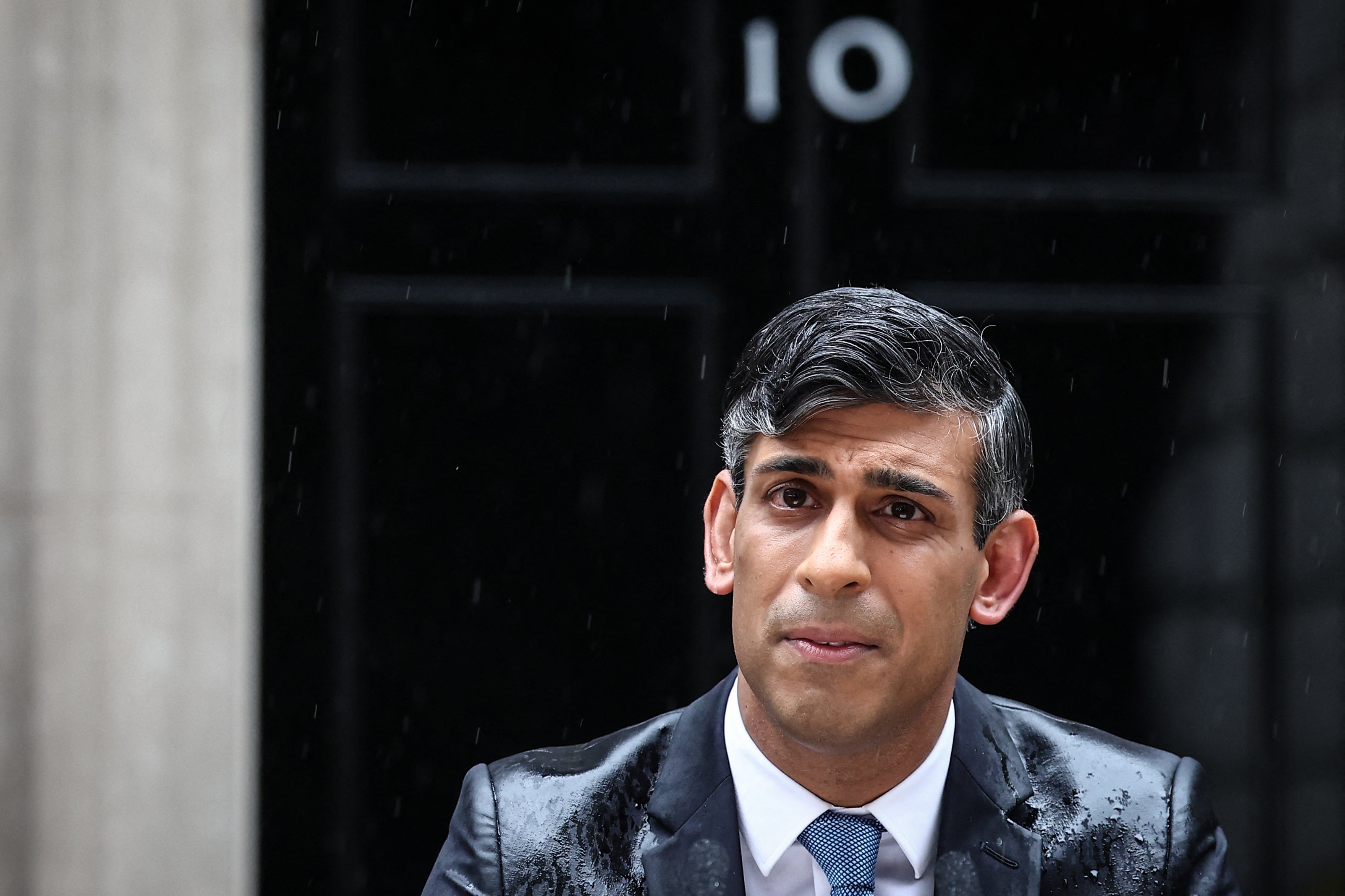 Rishi Sunak, soaked in rain, announces the July 4 general election