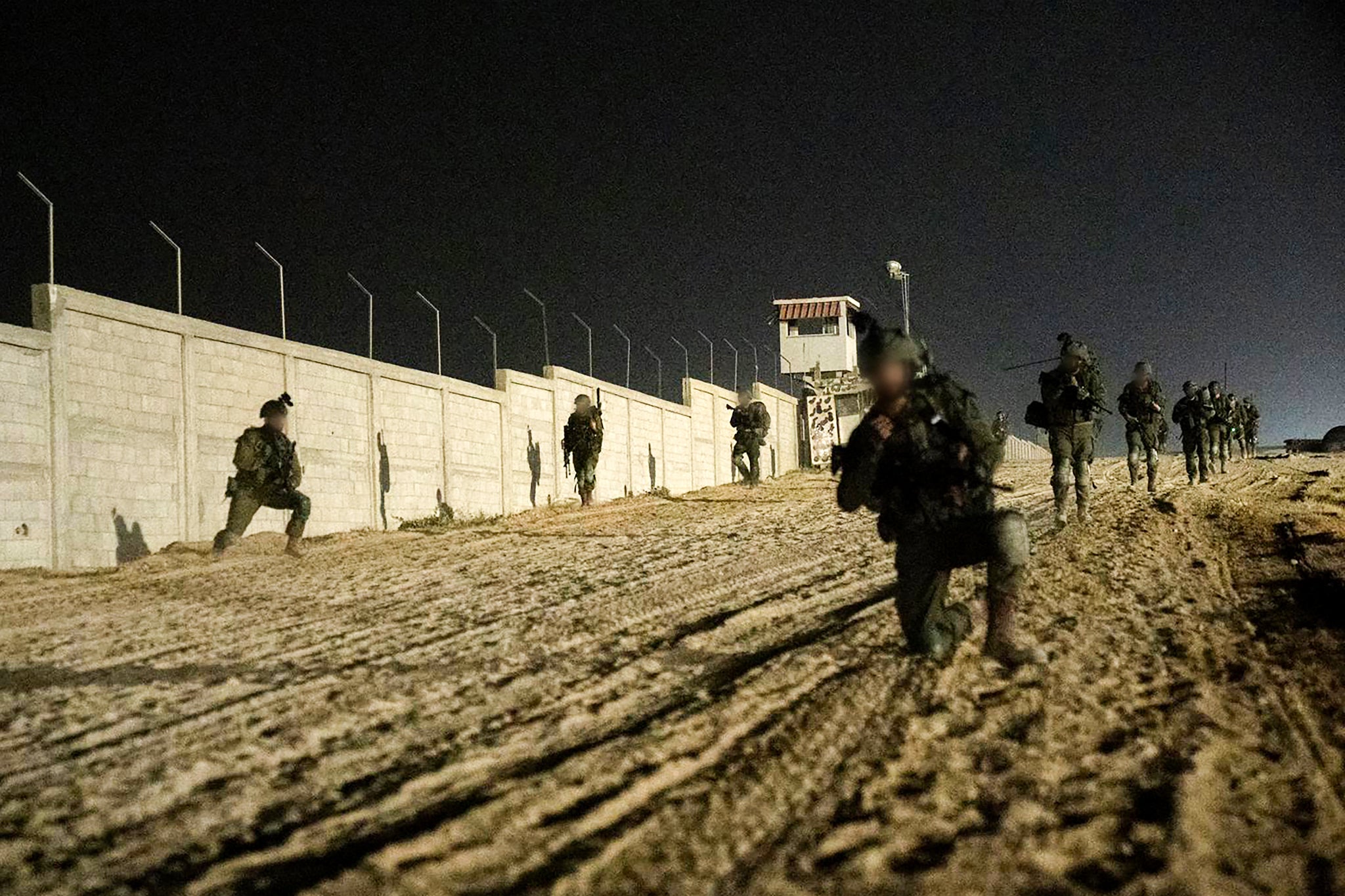 Israeli soldiers operate on the border in the southern Gaza Strip