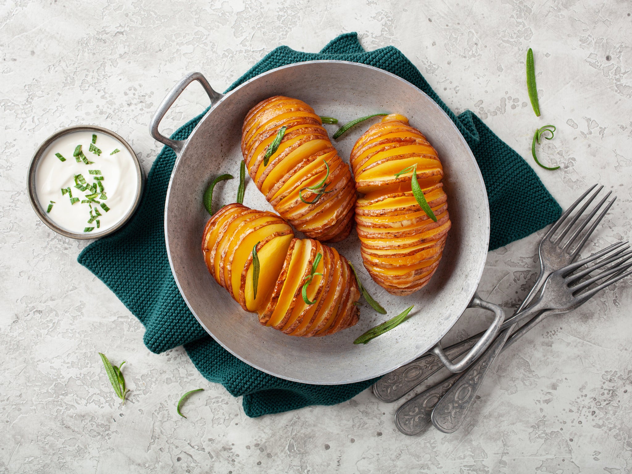Perfectly crispy hasselback potatoes made in the air fryer, seasoned to perfection