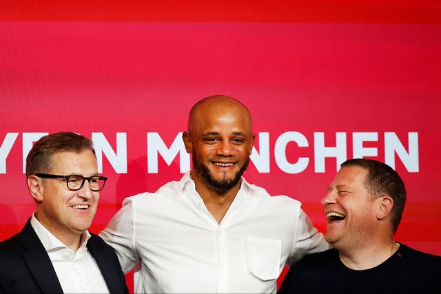 <p>Bayern Munich CEO Jan-Christian Dreesen, left, and sporting director Max Eberl, right, unveil new manager Vincent Kompany </p>