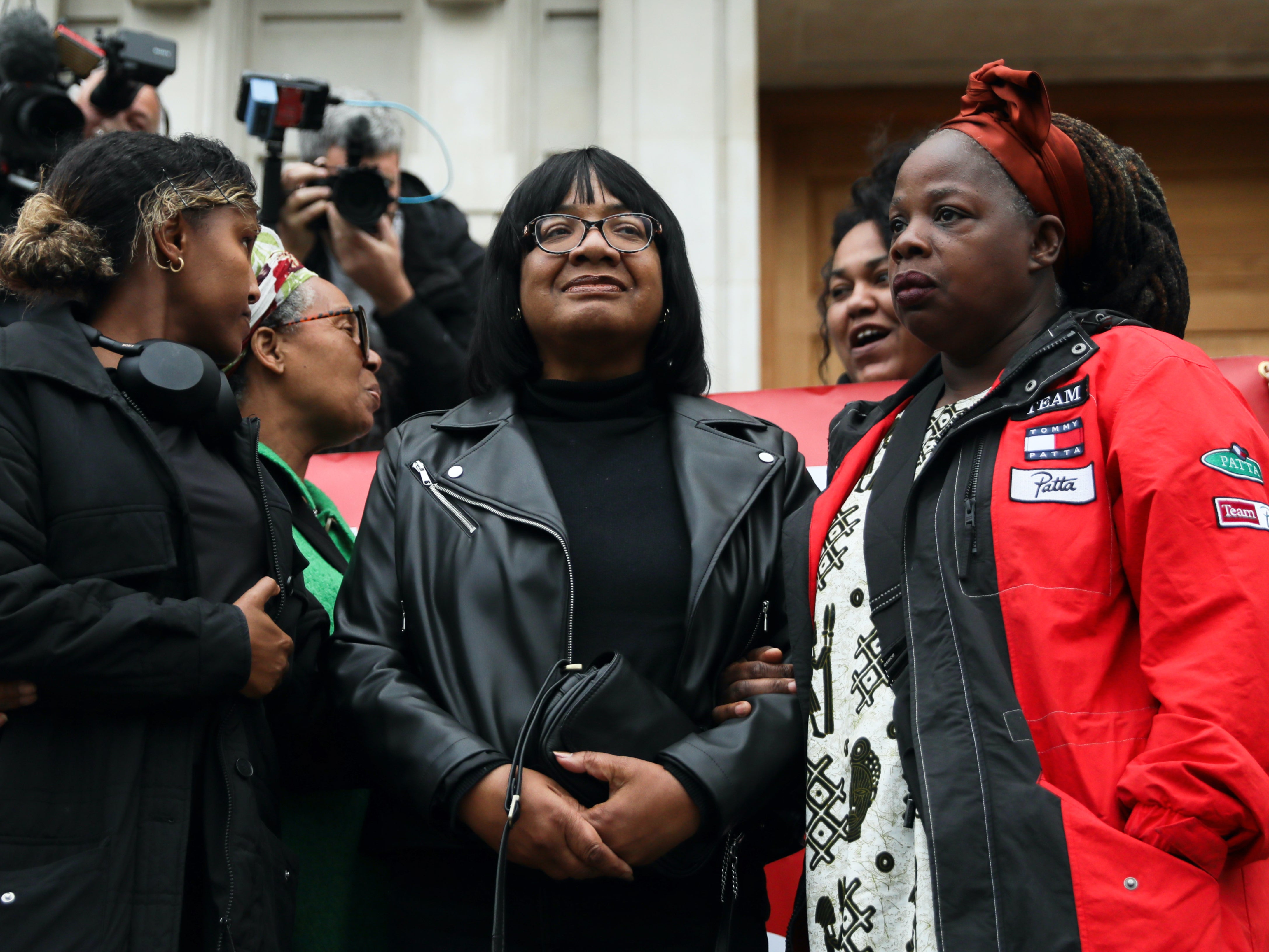 Diane Abbott stands on the steps of Hackney Town Hall on Wednesday