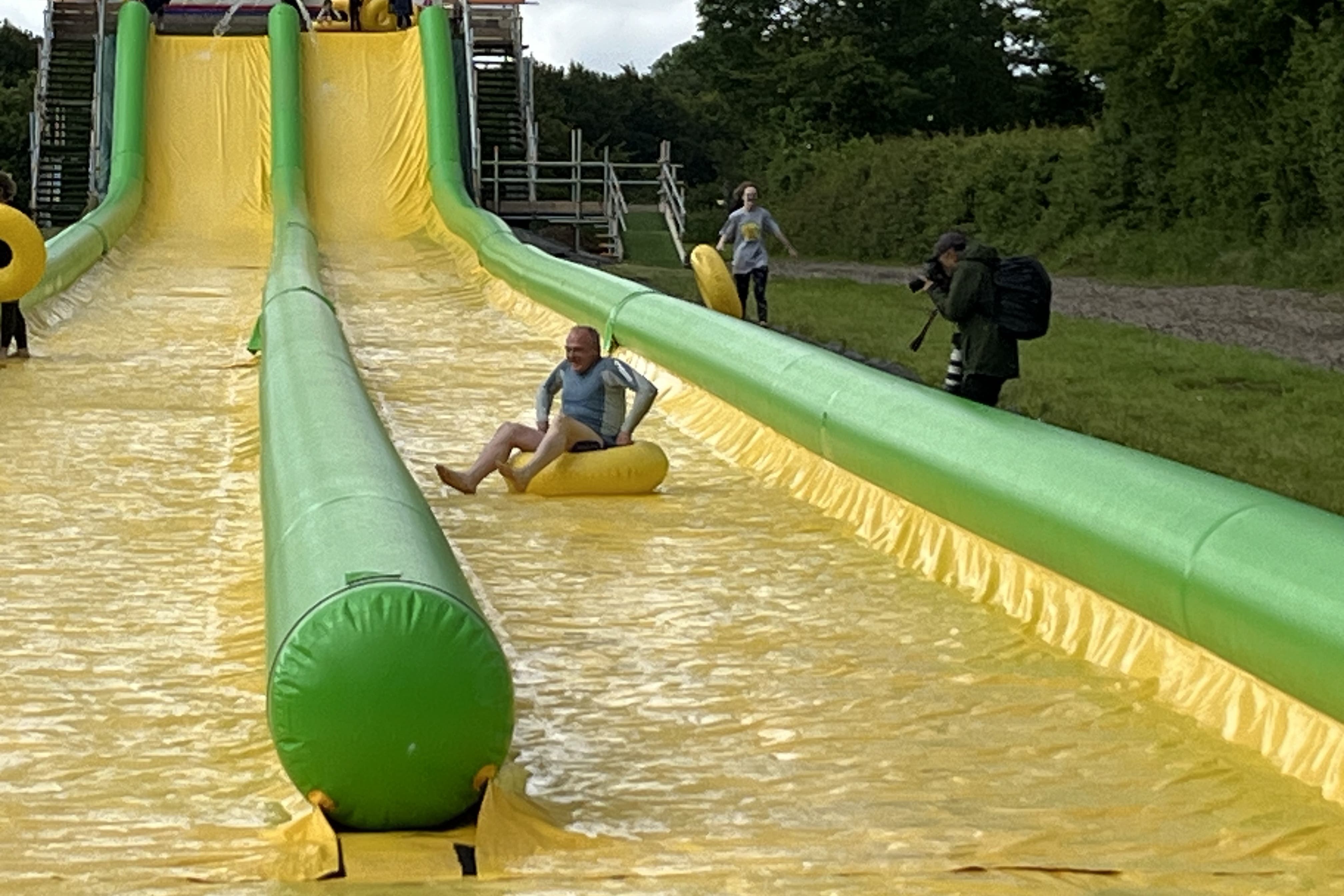 Leader of Liberal Democrats Sir Ed Davey after he rode down the Ultimate Slip n Slide attraction near Frome, Somerset, while on the General Election campaign trail (Rod Minchin/PA)