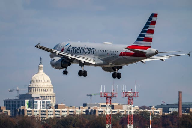 <p>An American Airlines flight pictured landing at the Ronald Reagan Washington National Airport outside of Washington, DC. An American Airlines flight almost collided with a private plane after both flights were cleared to use intersecting runways</p>