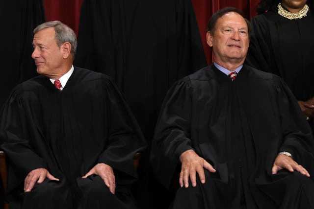 <p>United States Supreme Court Chief Justice John Roberts (L) and Associate Justice Samuel Alito (R) pose for an official portrait at the East Conference Room of the Supreme Court building on October 7, 2022 in Washington, DC</p>