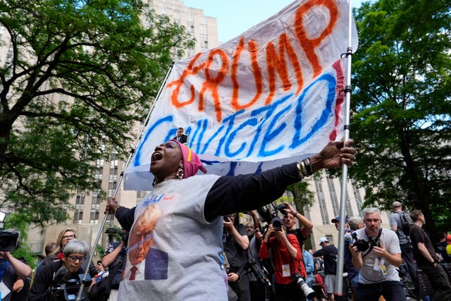 <p>A demonstrator reacts to the guilty verdict announced against former President Donald Trump</p>