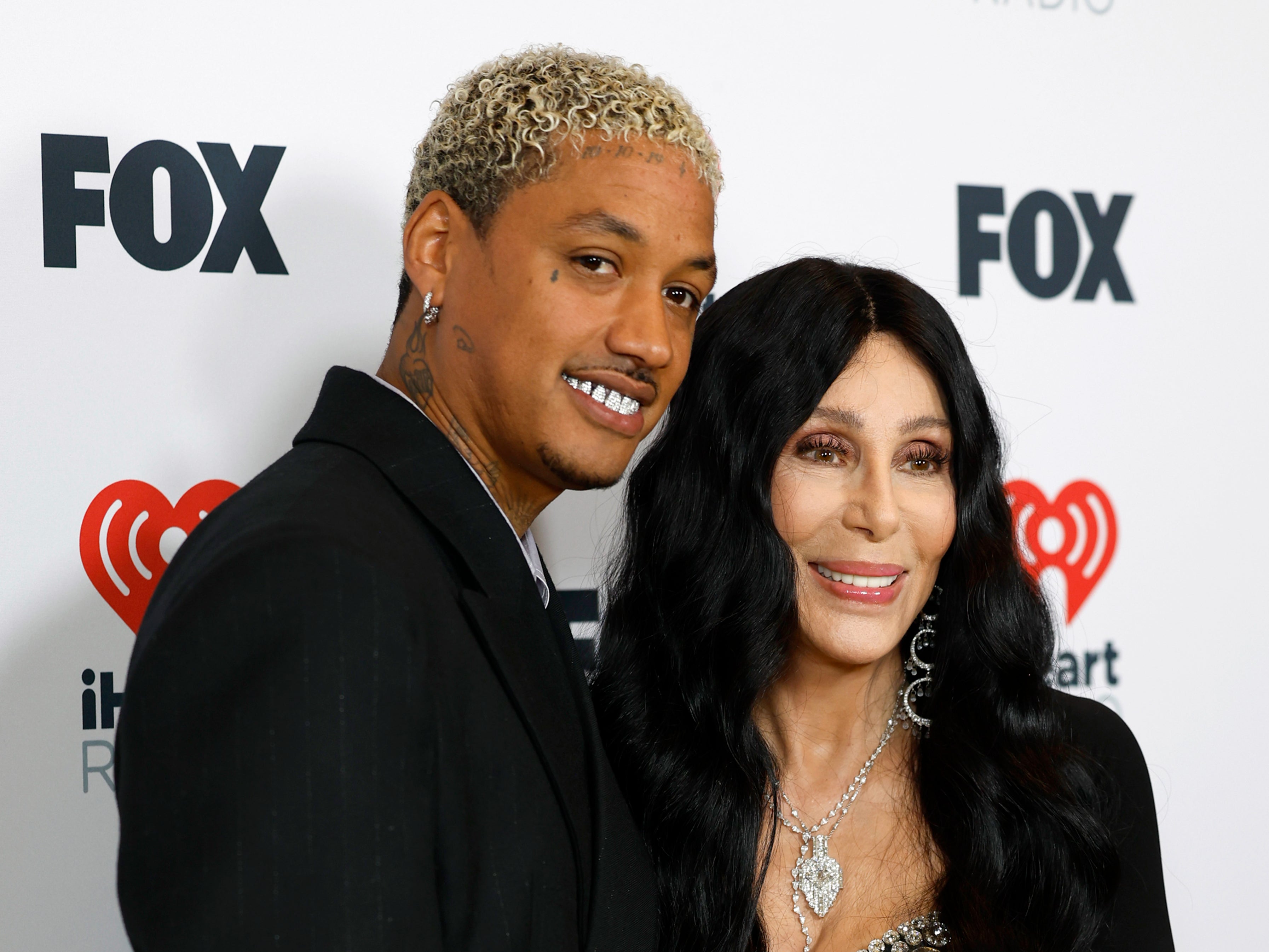 Alexander “AE” Edwards and Cher pose in the press room during the 2024 iHeartRadio Music Awards at the Dolby Theater on April 1, 2024 in Hollywood, California (Getty Images)