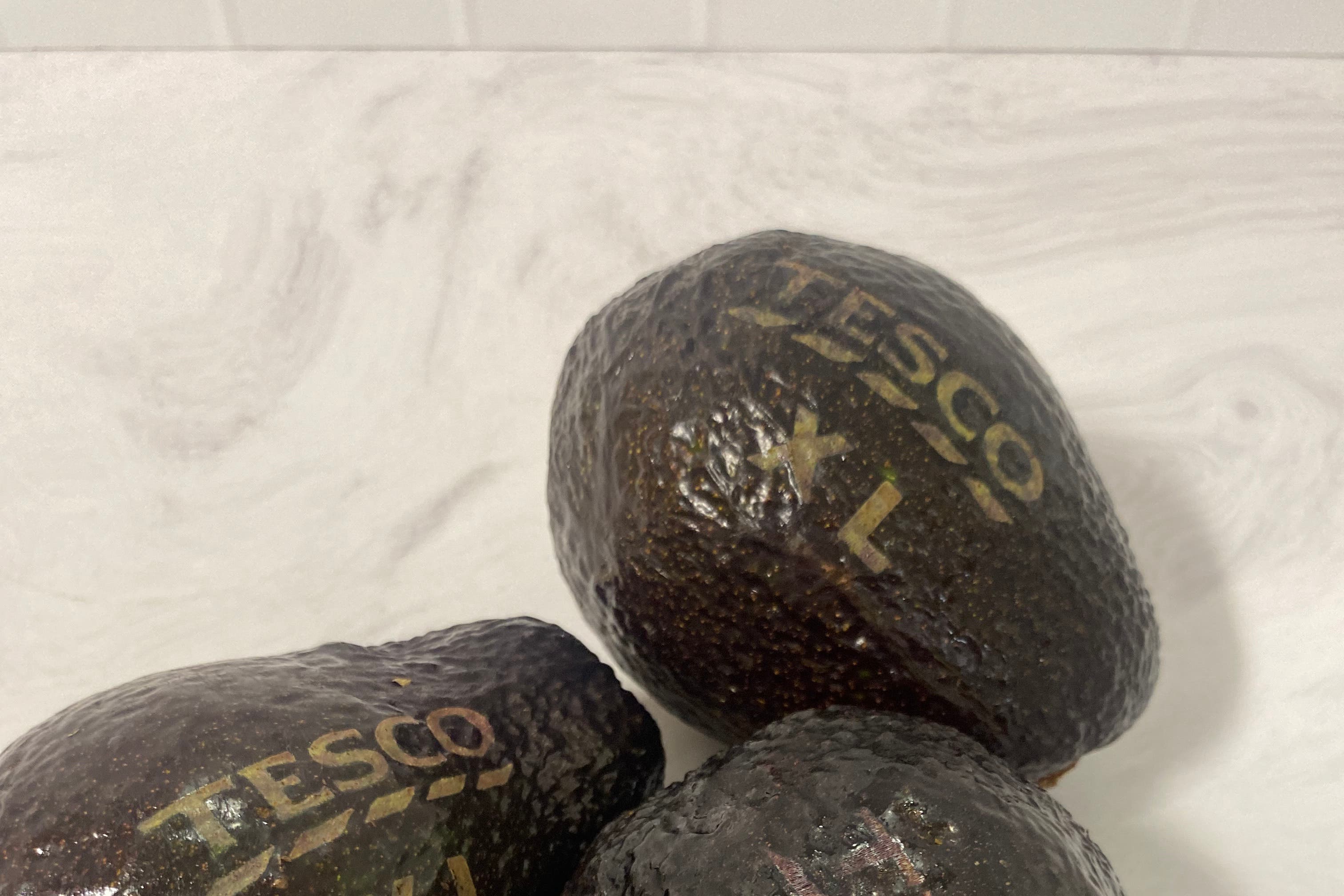 Tesco is to use laser-etchings on its extra large avocados instead of stickers in a trial designed to help the environment (Tesco/ PA)