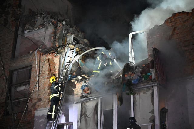 Rescuers extinguish a fire in an apartment building destroyed by a Russian missile attack in Kharkiv early on  May 31, 2024, amid the Russian invasion in Ukraine. Russian strikes killed three people in the Ukrainian city of Kharkiv, authorities said today, after the United States had authorised Kyiv to use American weapons to hit targets inside Russia in defence of the region