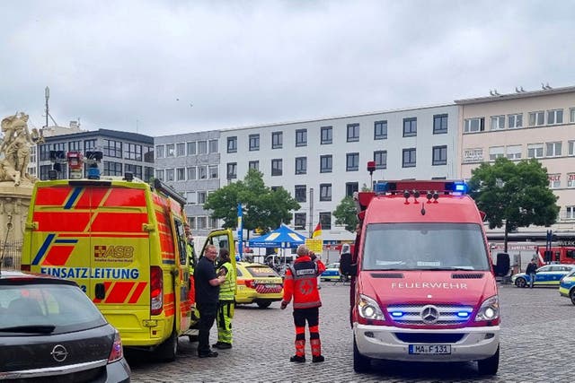 <p>Police and firefighters at the scene in Mannheim after a knife attack  </p>