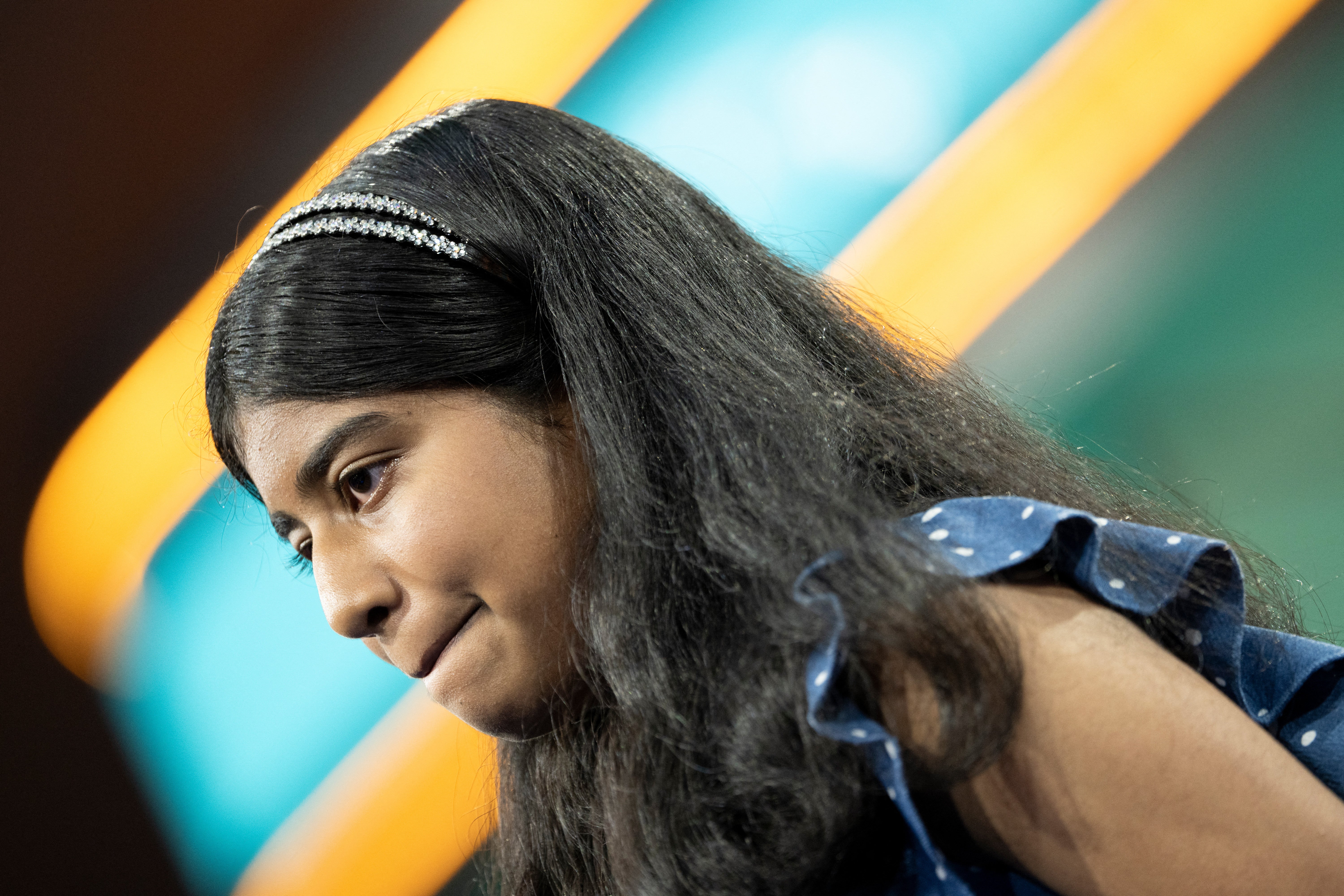 Aditi Muthukumar, of Denver, Colorado, reacts to a word she was given to spell during the 96th Scripps National Spelling Bee competition final round at the Gaylord National Resort and Convention Center, in National Harbor, Maryland on May 30, 2024
