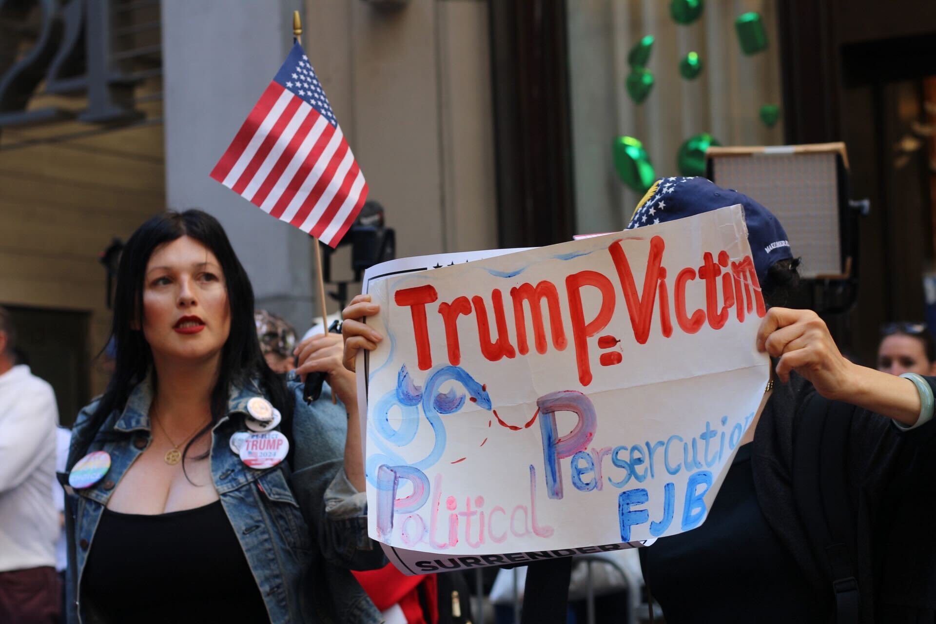 Trump supporters gather outside Trump Tower ahead of the former president’s press conference on Friday 31 May in New York City