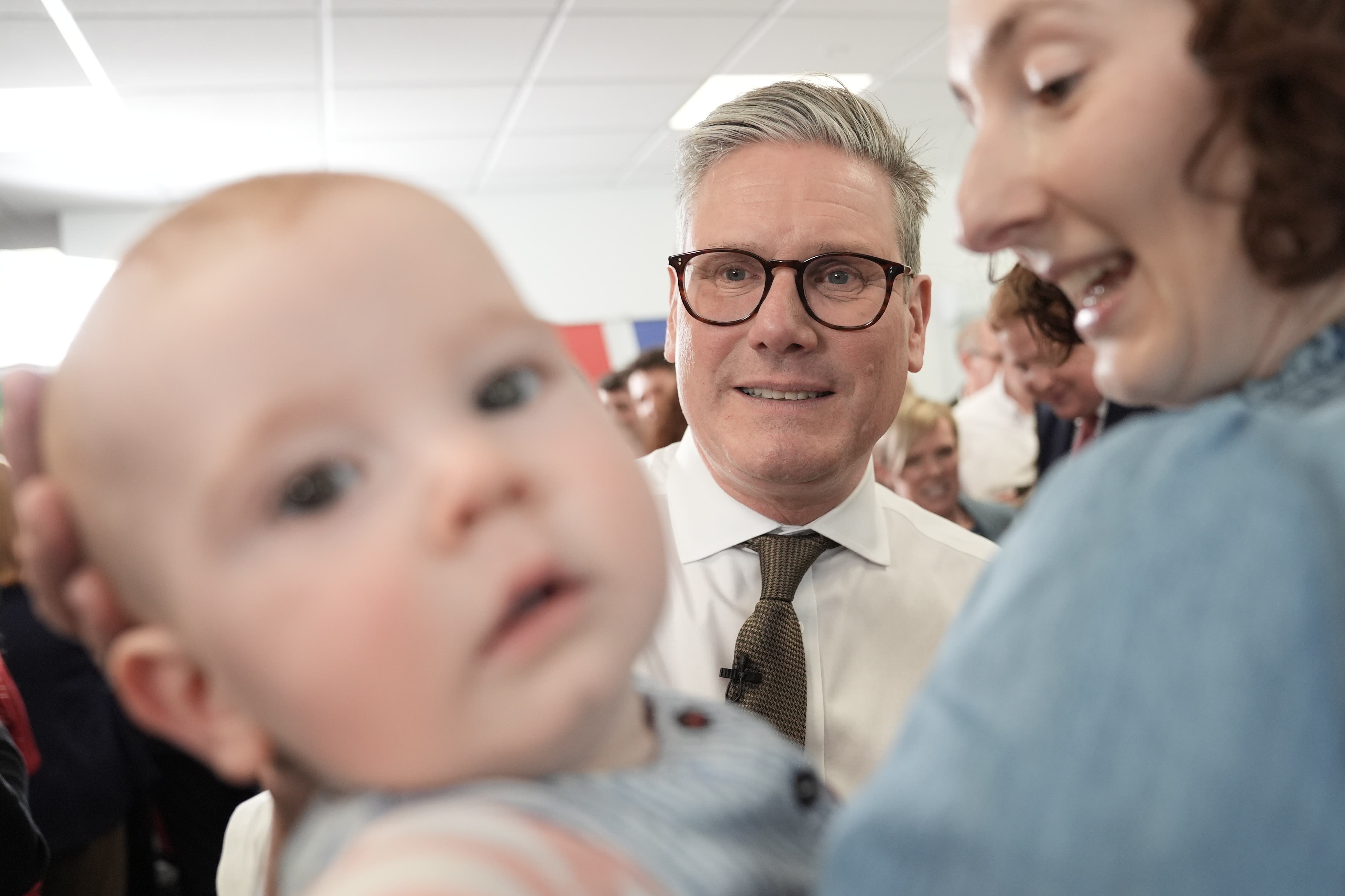 Labour Party leader Sir Keir Starmer held two separate events in Worcester during the first week of the election campaign, including meeting a camera-friendly baby at Worcester City football club (Stefan Rousseau/PA)