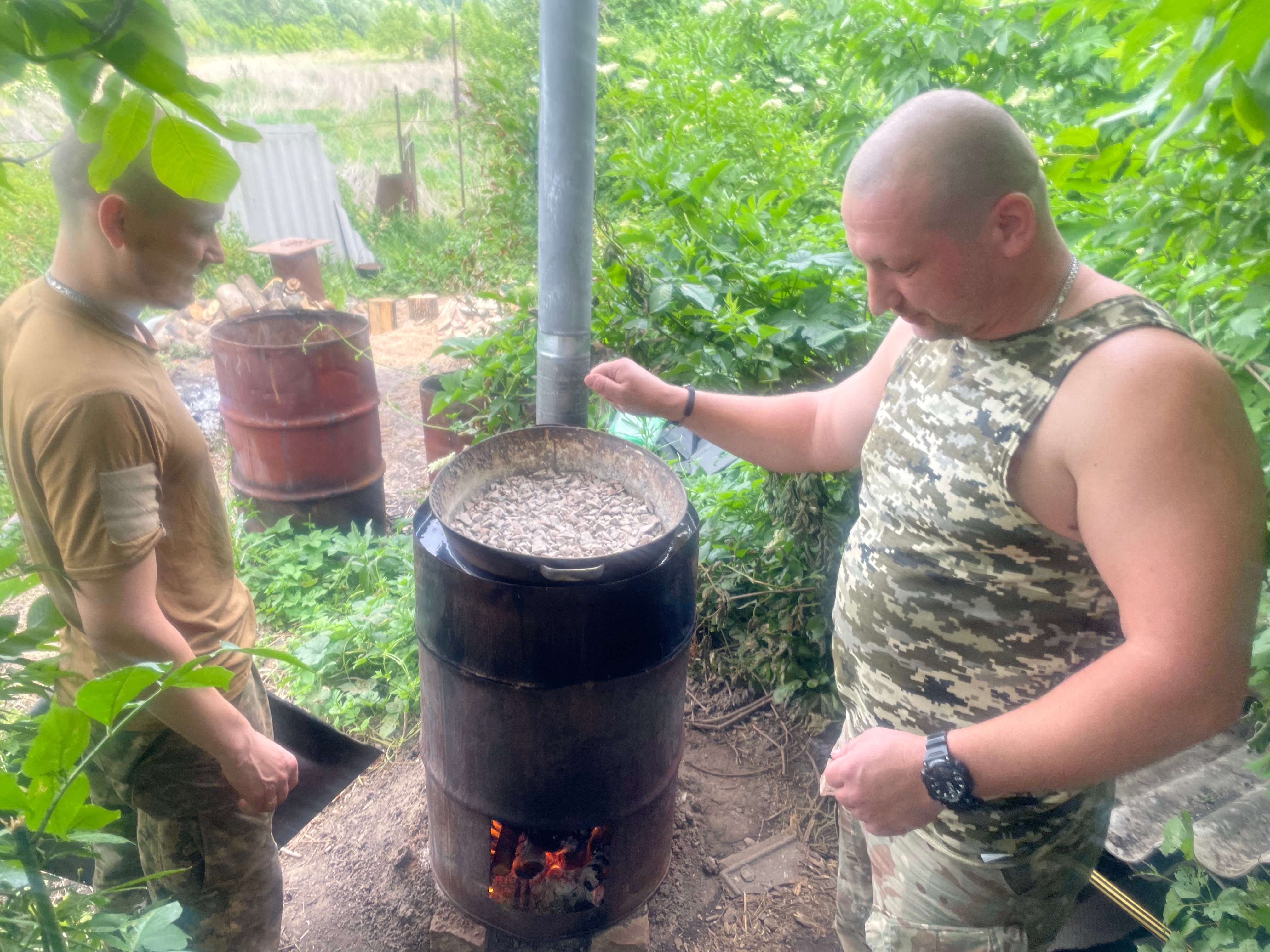 Soldiers from the unit, in the Siversk area of the Donetsk region, melt explosive gathered from a mine to form a drone bomb