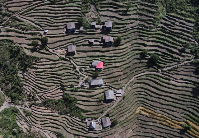 <p>A drone view shows houses in Almi, the village hosting a remote polling station, ahead of the seventh and final phase of the general election</p>