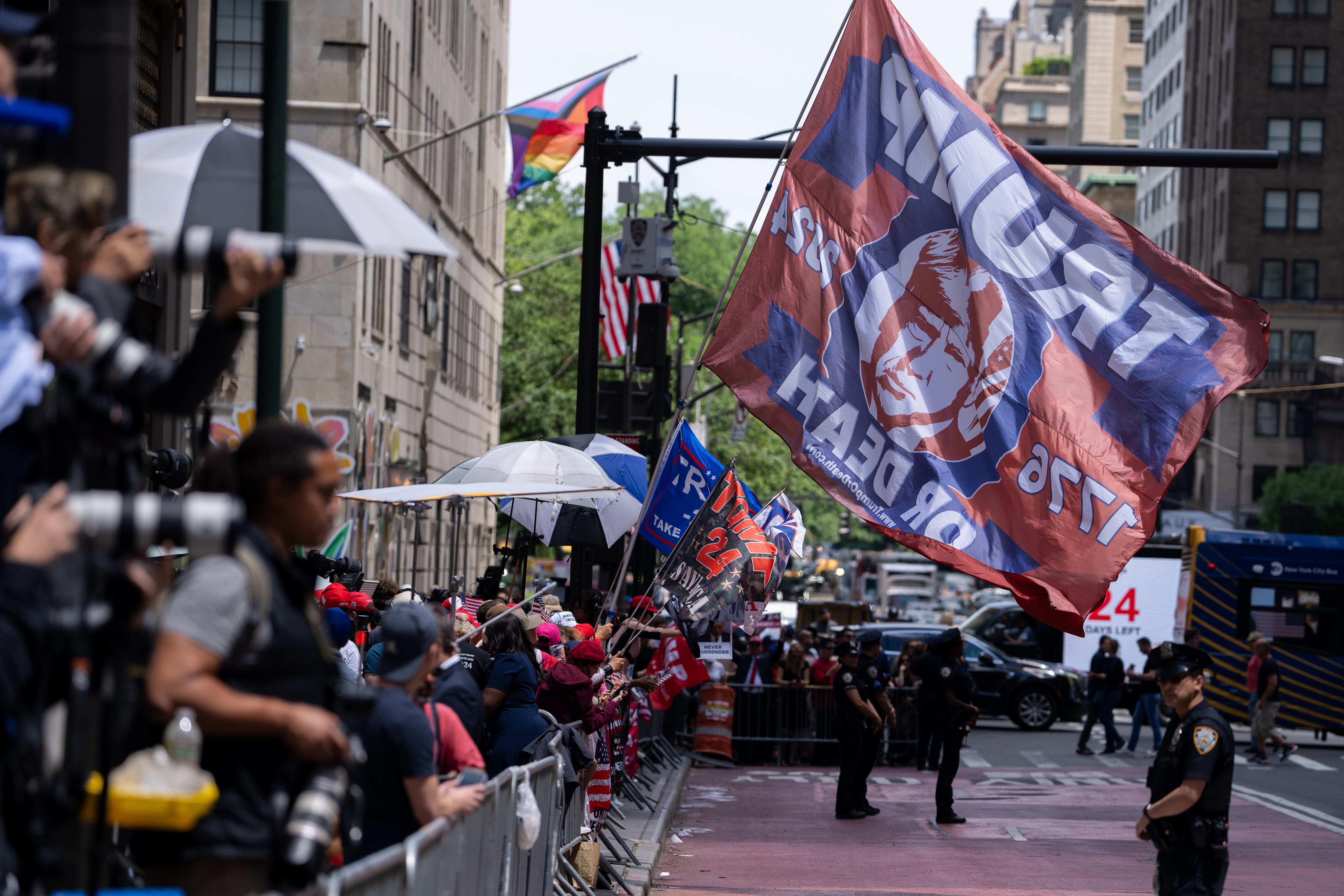 A crowd of Trump supporters, counter protesters and news media gather behind police barricades in front of Trump Tower on May 31.