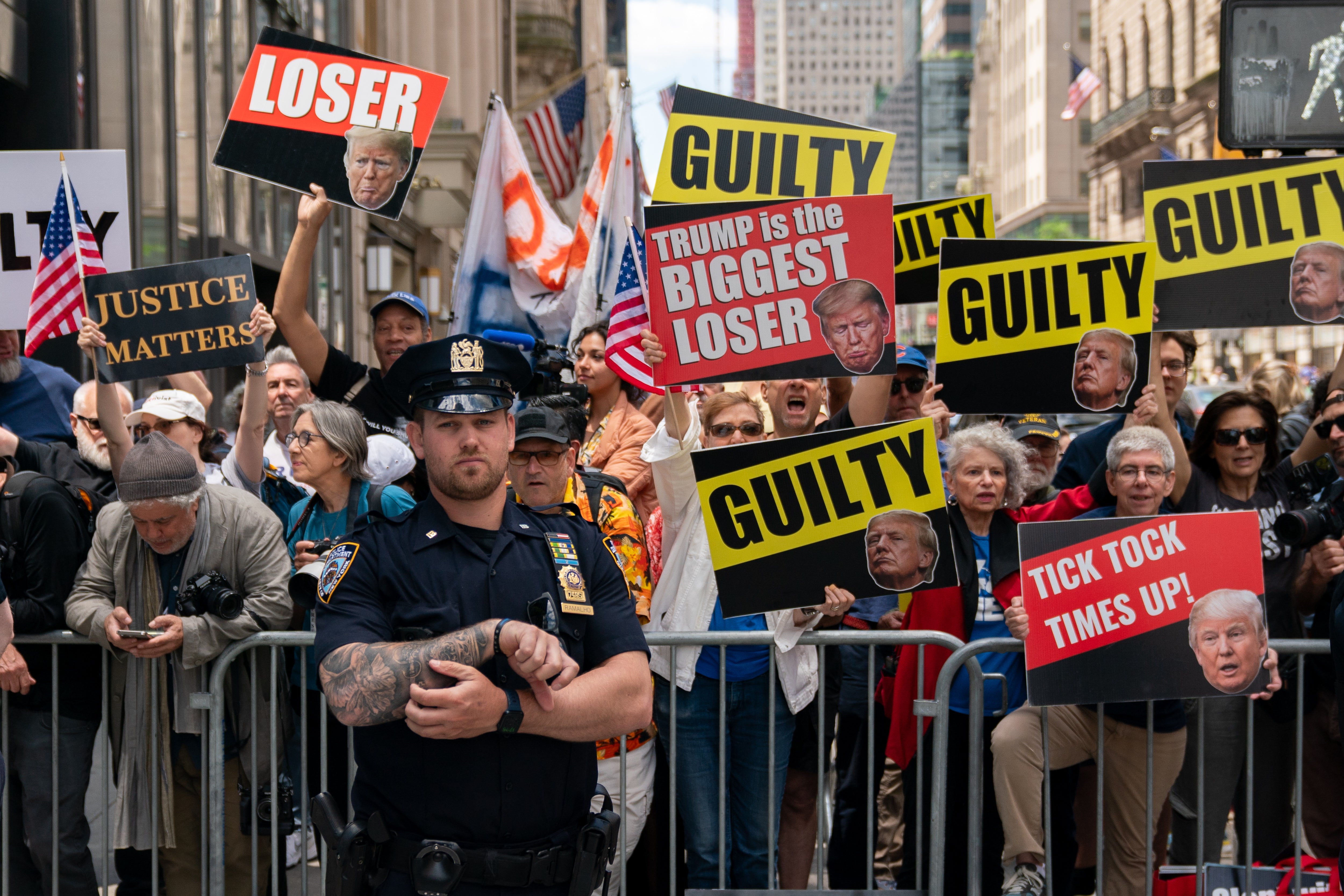 Anti-Former President and Republican Presidential candidate Donald Trump protestors gather at Trump Tower on May 31, 2024 in New York City.