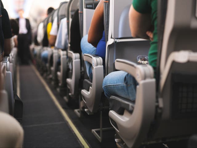 <p>An aisle on an airplane (<em>Getty Images/iStockphoto</em>)</p>
