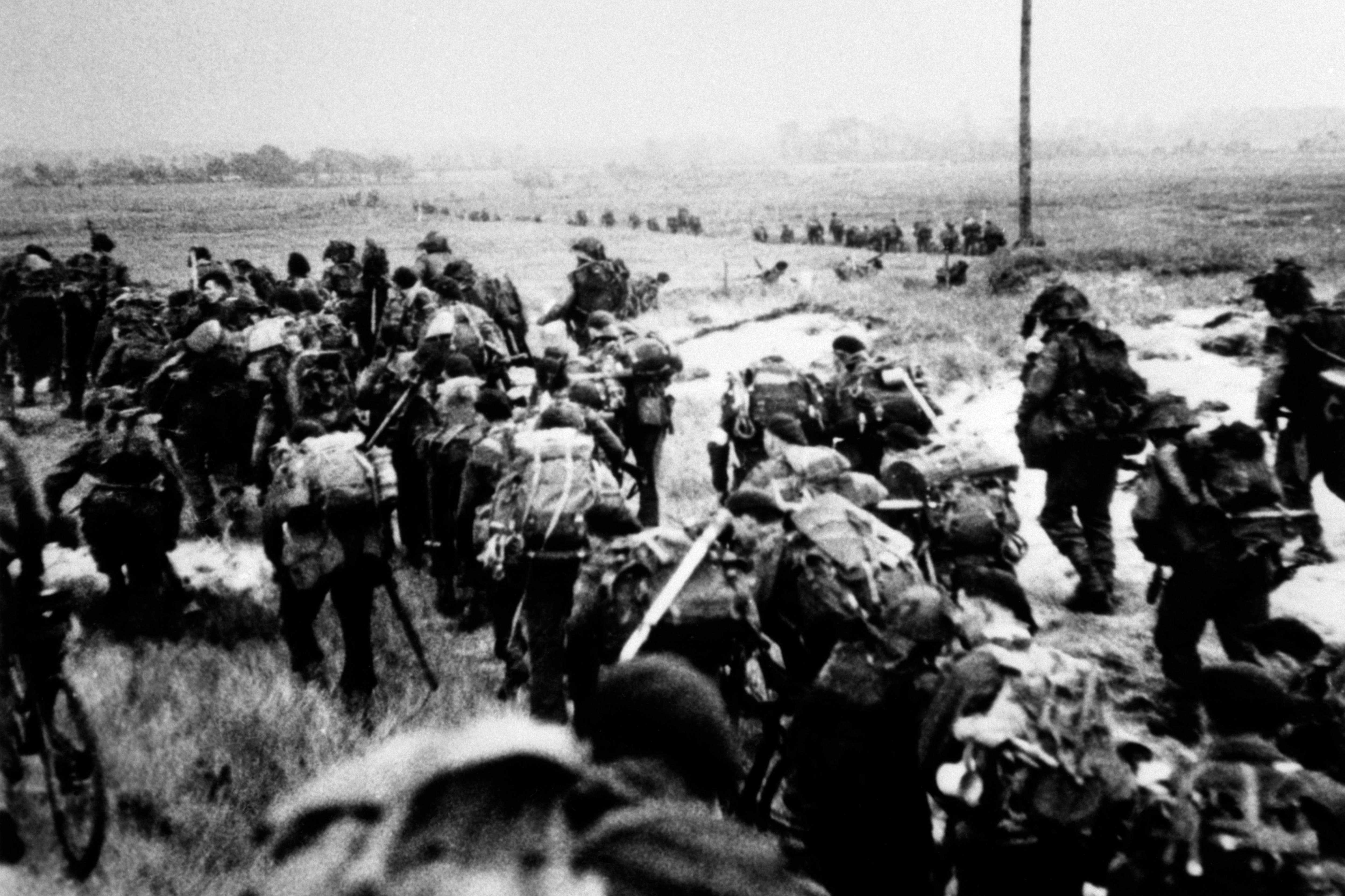 Royal Marine commandos moving off Sword beach following the D-Day landings (PA)