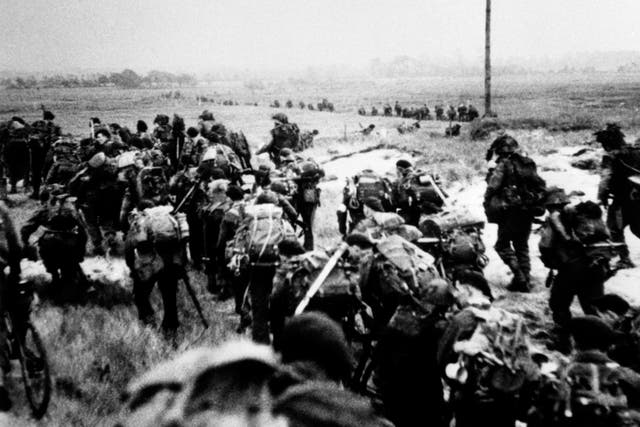 Royal Marine commandos moving off Sword beach following the D-Day landings (PA)