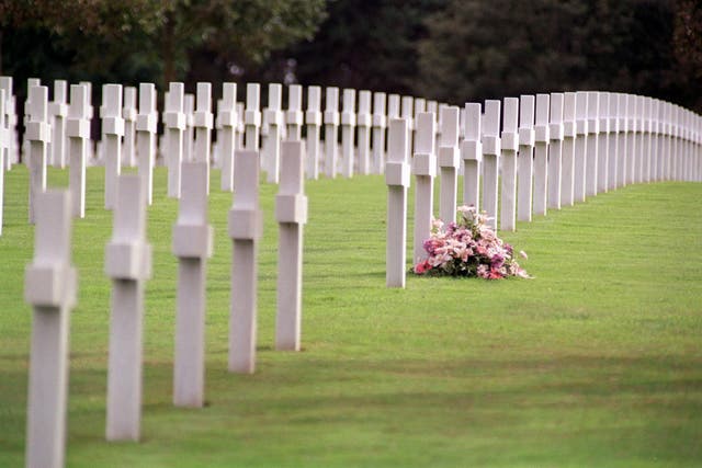 Flowers lie at an gravestone in one of the 14 permanent US Second World War cemeteries (Michael Walter/PA)