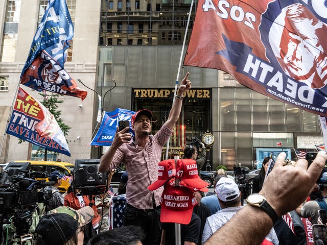 <p>Protesters gather outside Trump Tower in New York City on the day of his conviction</p>