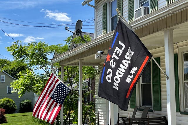 <p>An American flag flies upside down outside a Pennsylvania home in apparent protest against Donald Trump’s criminal conviction</p>