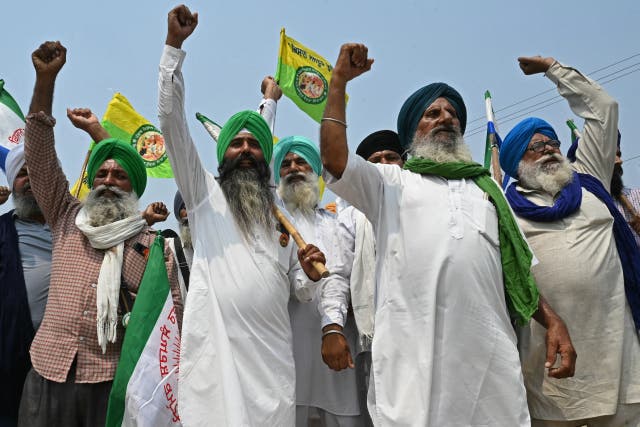<p>Farmers shout slogans against India’s Prime Minister and leader of the ruling Bharatiya Janata Party (BJP) Narendra Modi, during a protest to demand minimum crop prices on the outskirts of Gurdaspur</p>