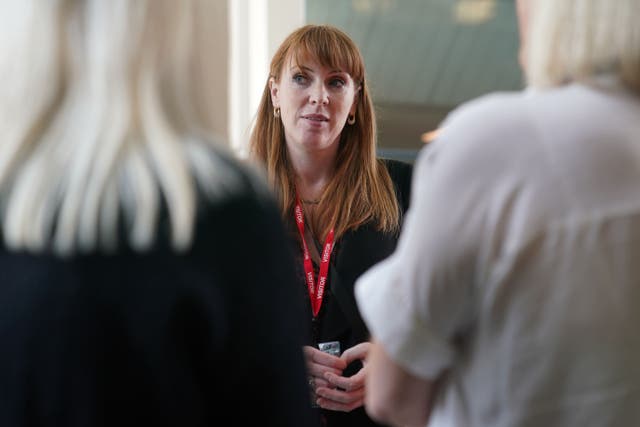 Labour Party deputy leader Angela Rayner talking to members of staff during a visit to London Stansted airport, in Essex, while on the General Election campaign trail. Picture date: Wednesday May 29, 2024.