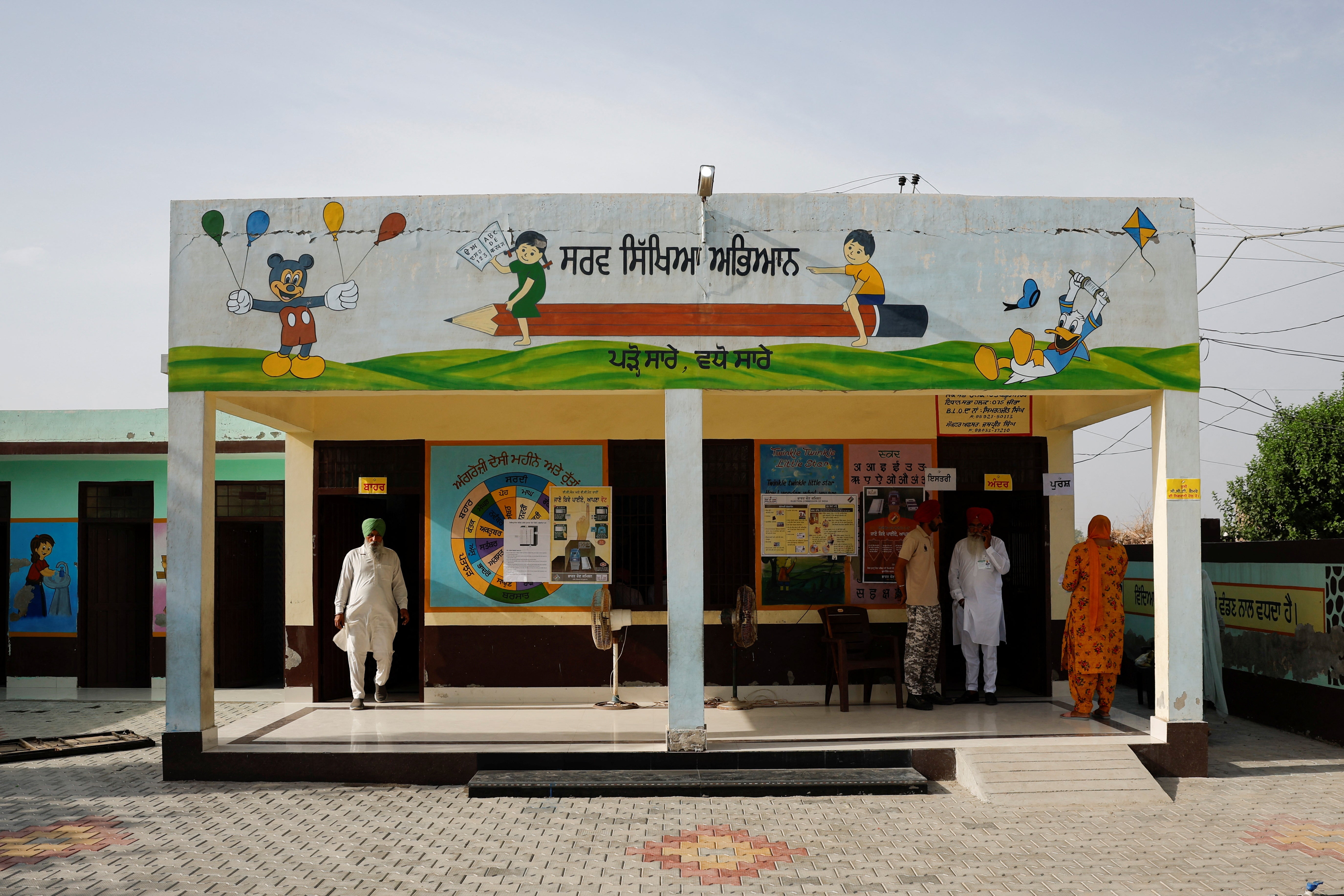 <p>A man walks out from a polling station after voting during the seventh and last phase of the general election, at a village in Firozpur district, Punjab, India, 1 June 2024</p>