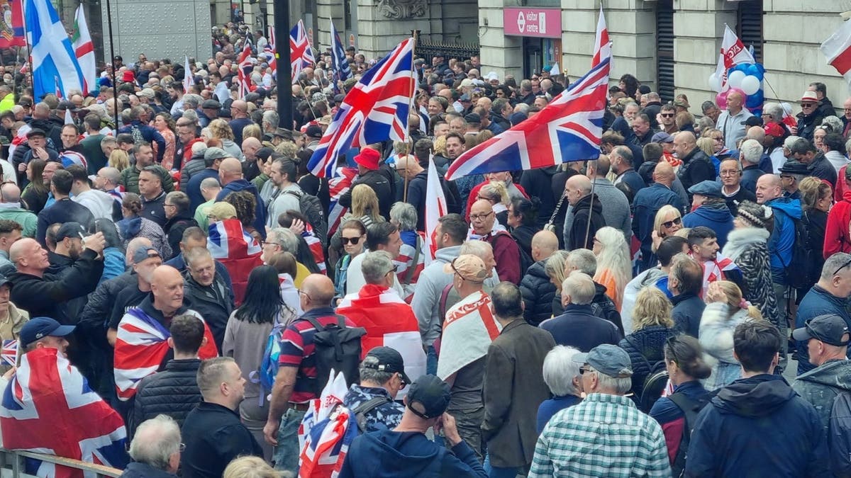 Tommy Robinson supporters gather ahead of Parliament Square screening