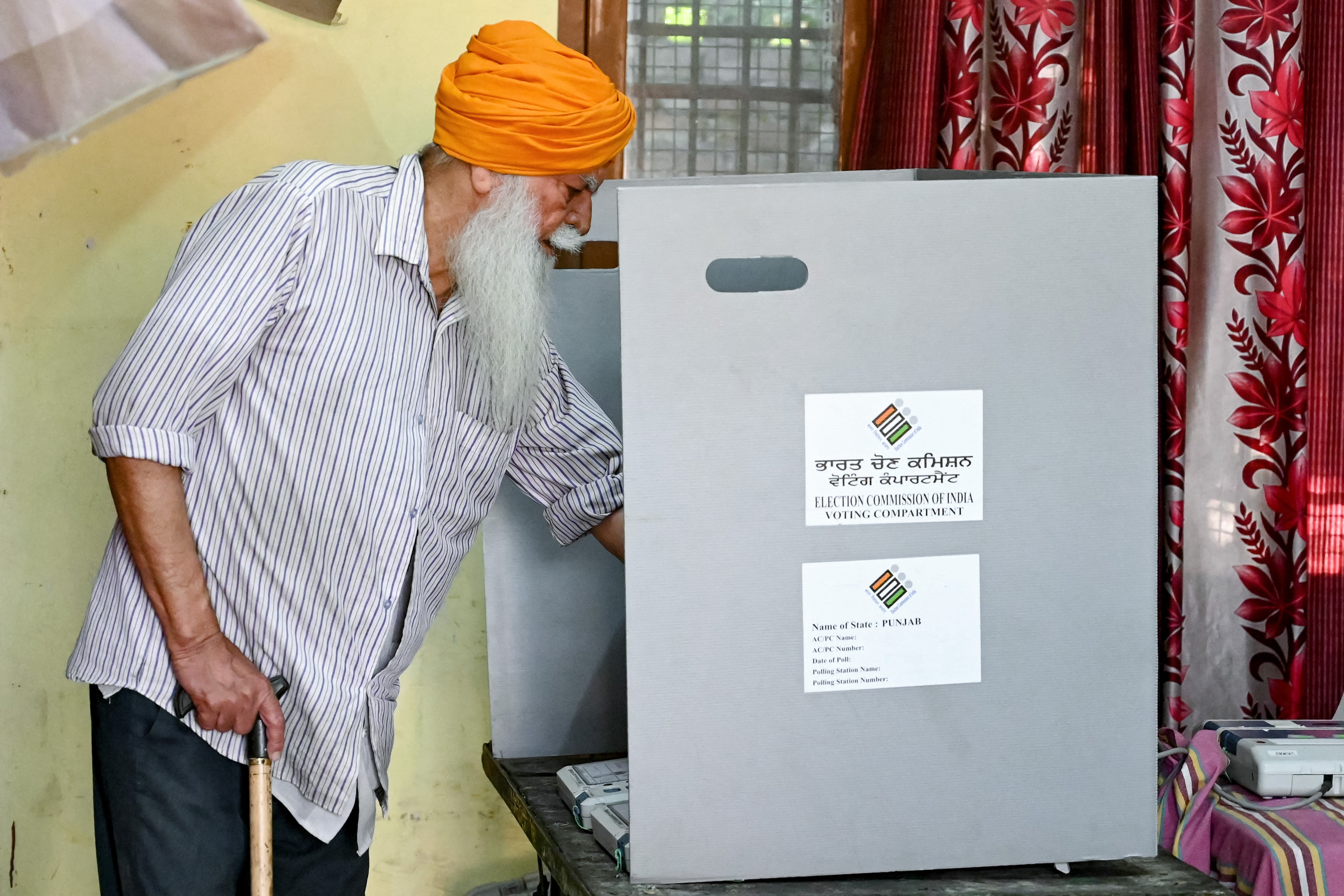 A man casts his ballot to vote at a polling station in Amritsar on 1 June 2024, during the seventh and final phase of voting in India’s general election