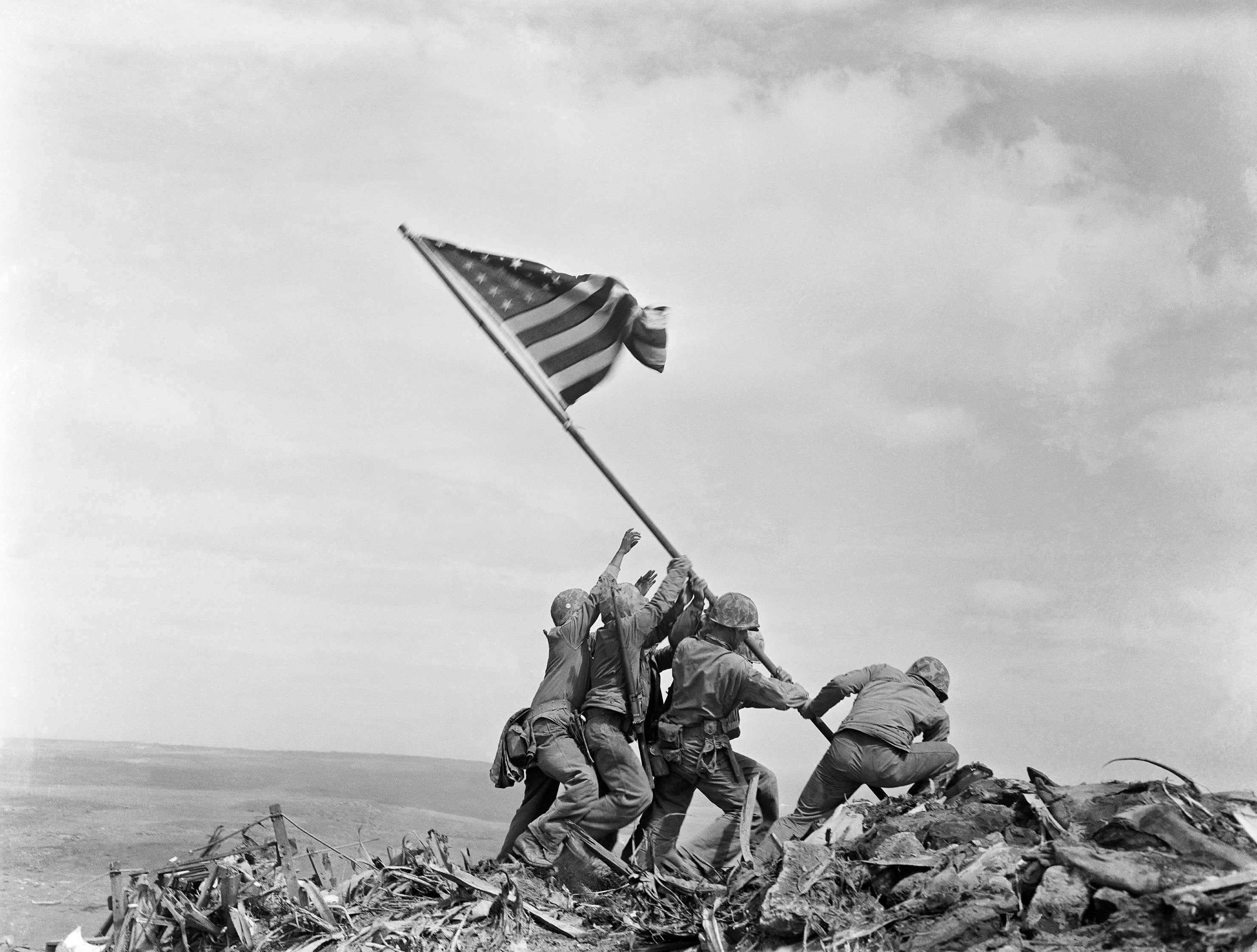 US Marines of the 28th Regiment, 5th Division, raise the Stars and Stripes on Mount Suribachi, Iwo Jima, Japan, on February 23, 1945, in what became one of the most iconic images of the Second World War