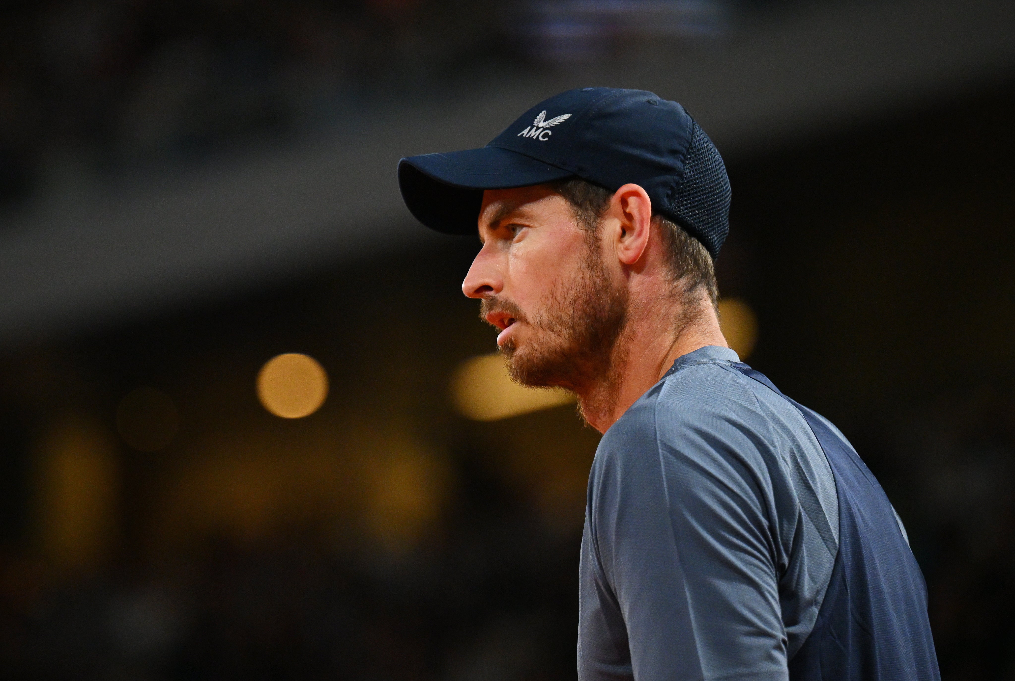 Andy Murray will switch focus to the grass court season after two first-round defeats at Roland Garros