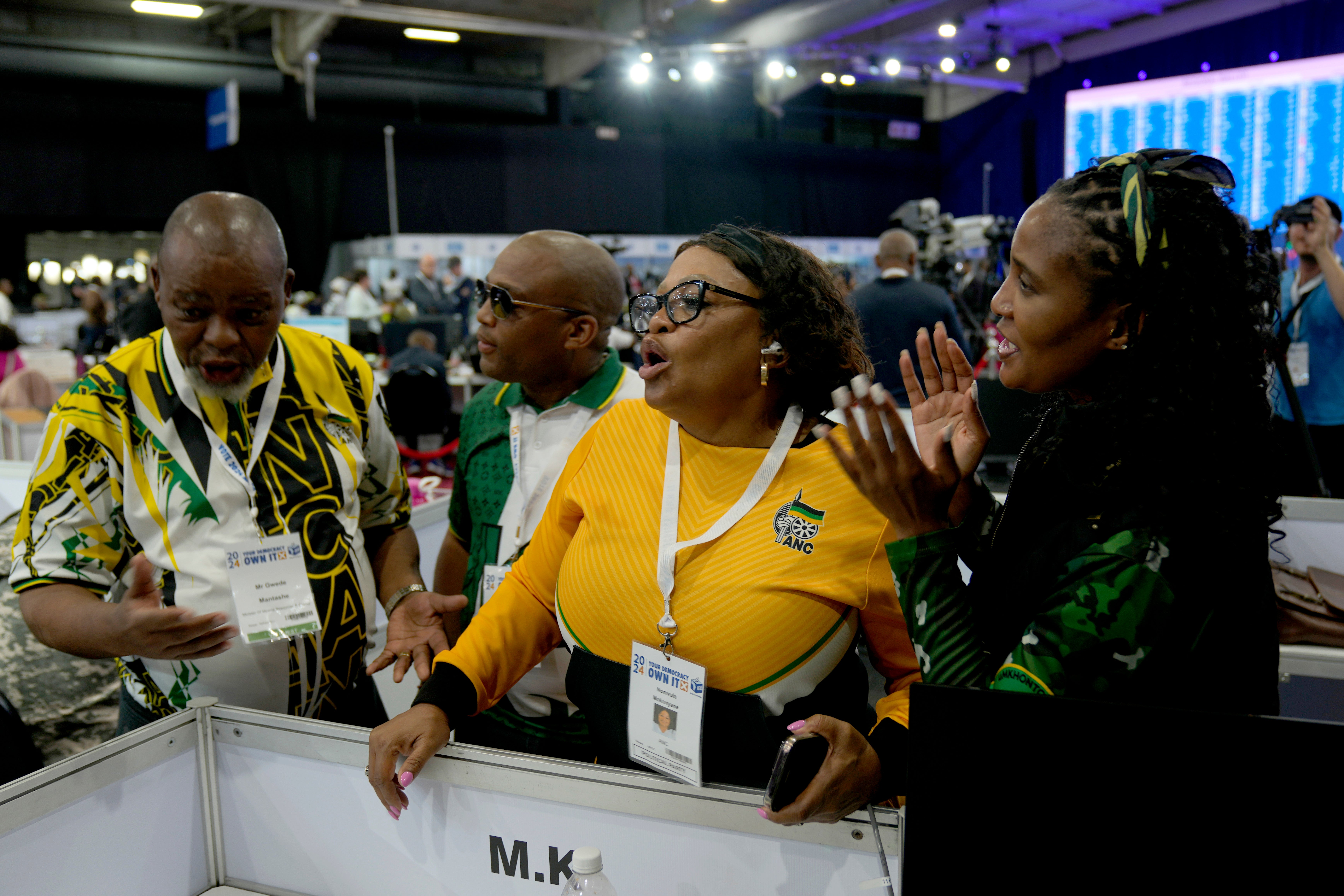 Deputy Secretary General of the African National Congress Nomvula Mokonyane, centre, reacts to the results board at the Results Operation Centre in Midrand, Johannesburg