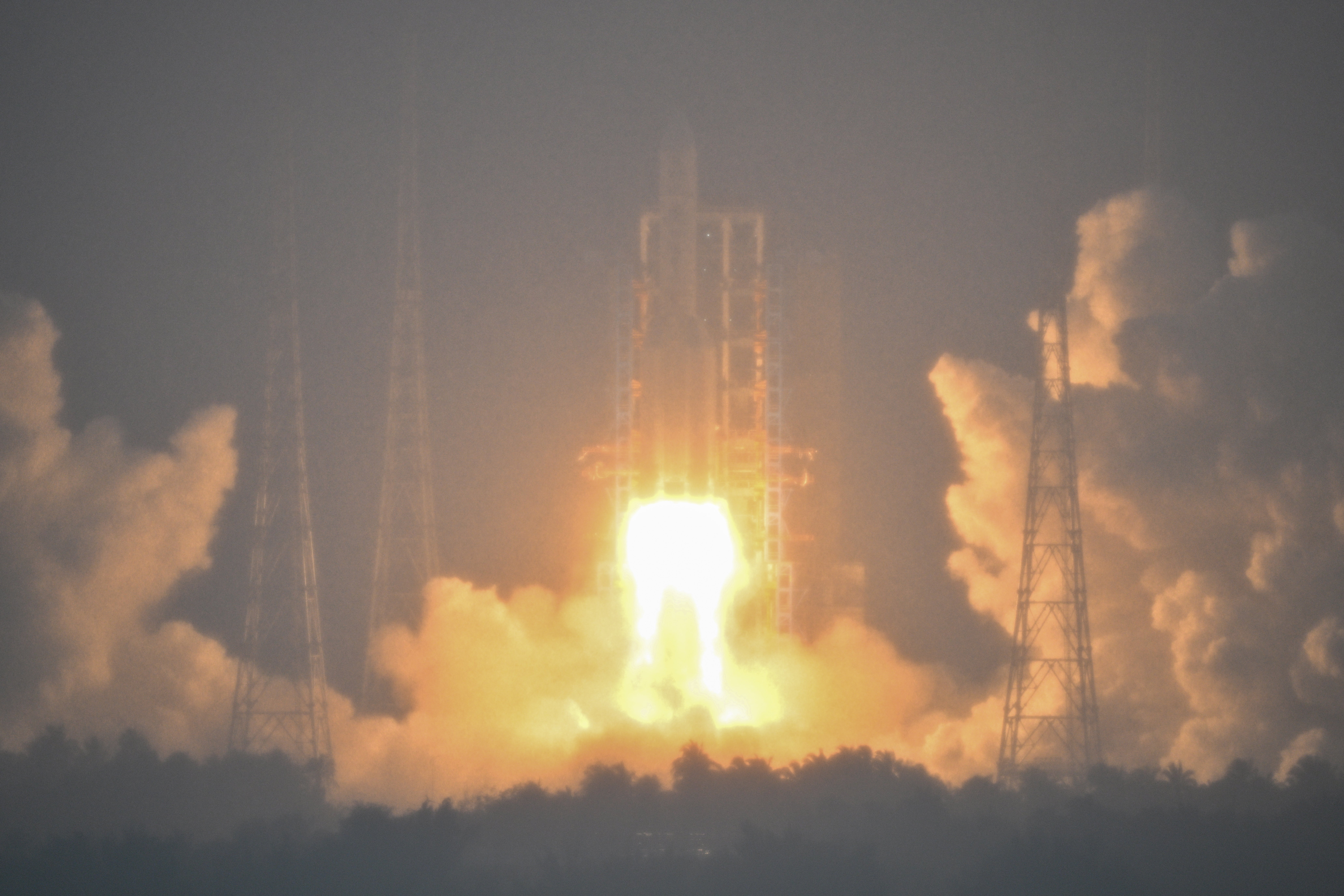 A Long March-5 rocket, carrying the Chang’e-6 mission lunar probe, lifts off as it rains at the Wenchang Space Launch Centre in southern China’s Hainan Province on 3 May 2024