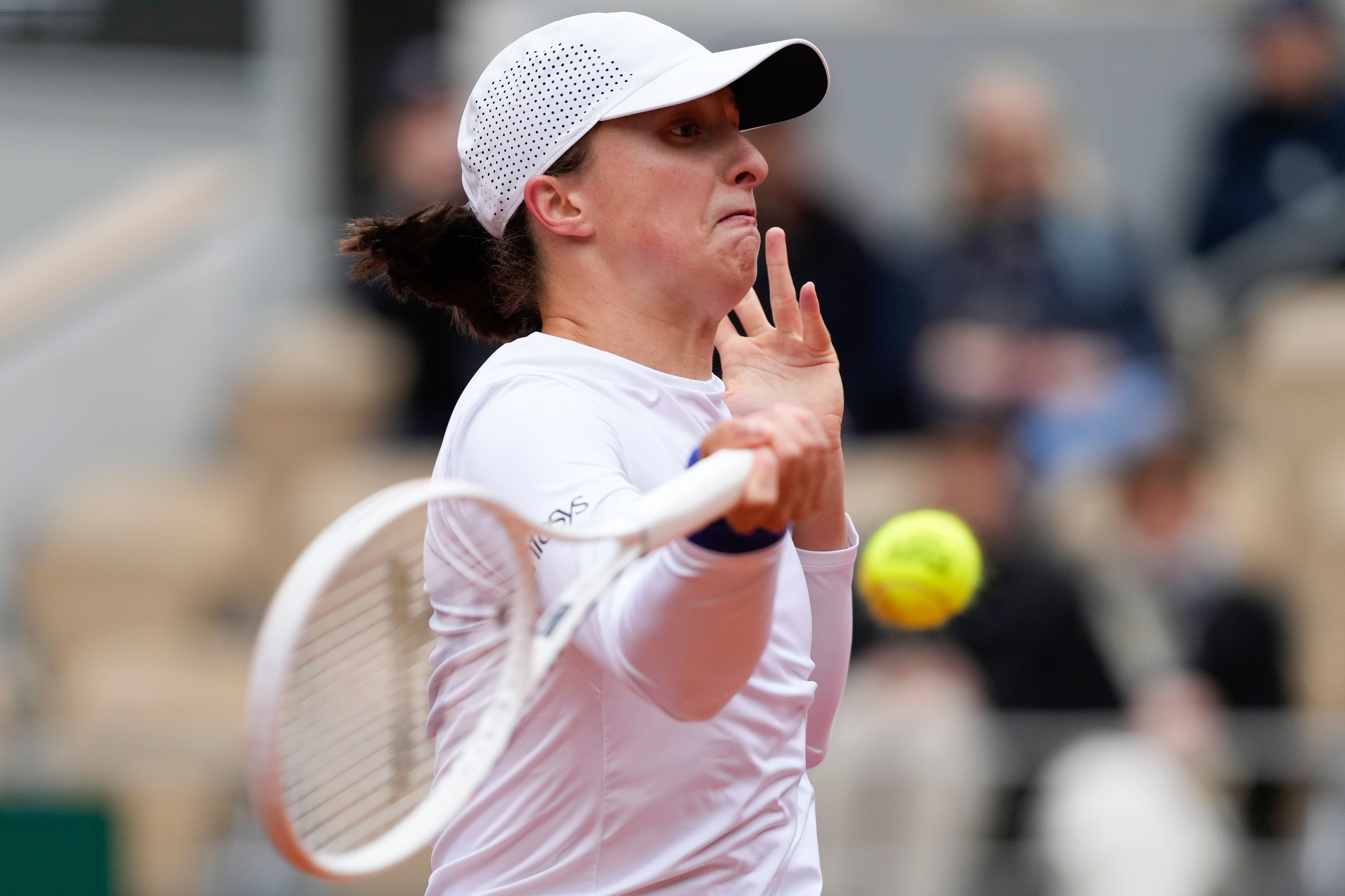 Iga Swiatek raced into the last eight (Thibault Camus/AP)