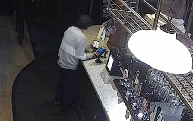 <p>Jonathan Blundell caught on CCTV handling the collection boxes at the Wetherspoon pub in Nottingham</p>