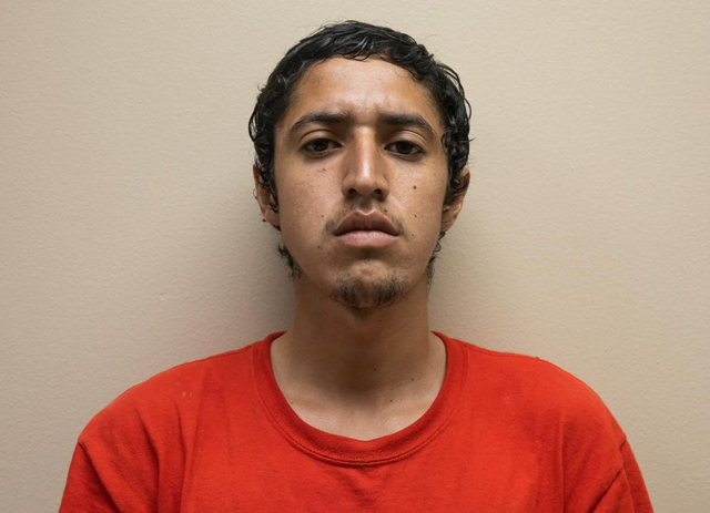 <p>Aaron Cervantes, pictured in a booking photo, has been charged with killing his uncle during a dispute over chickens</p>